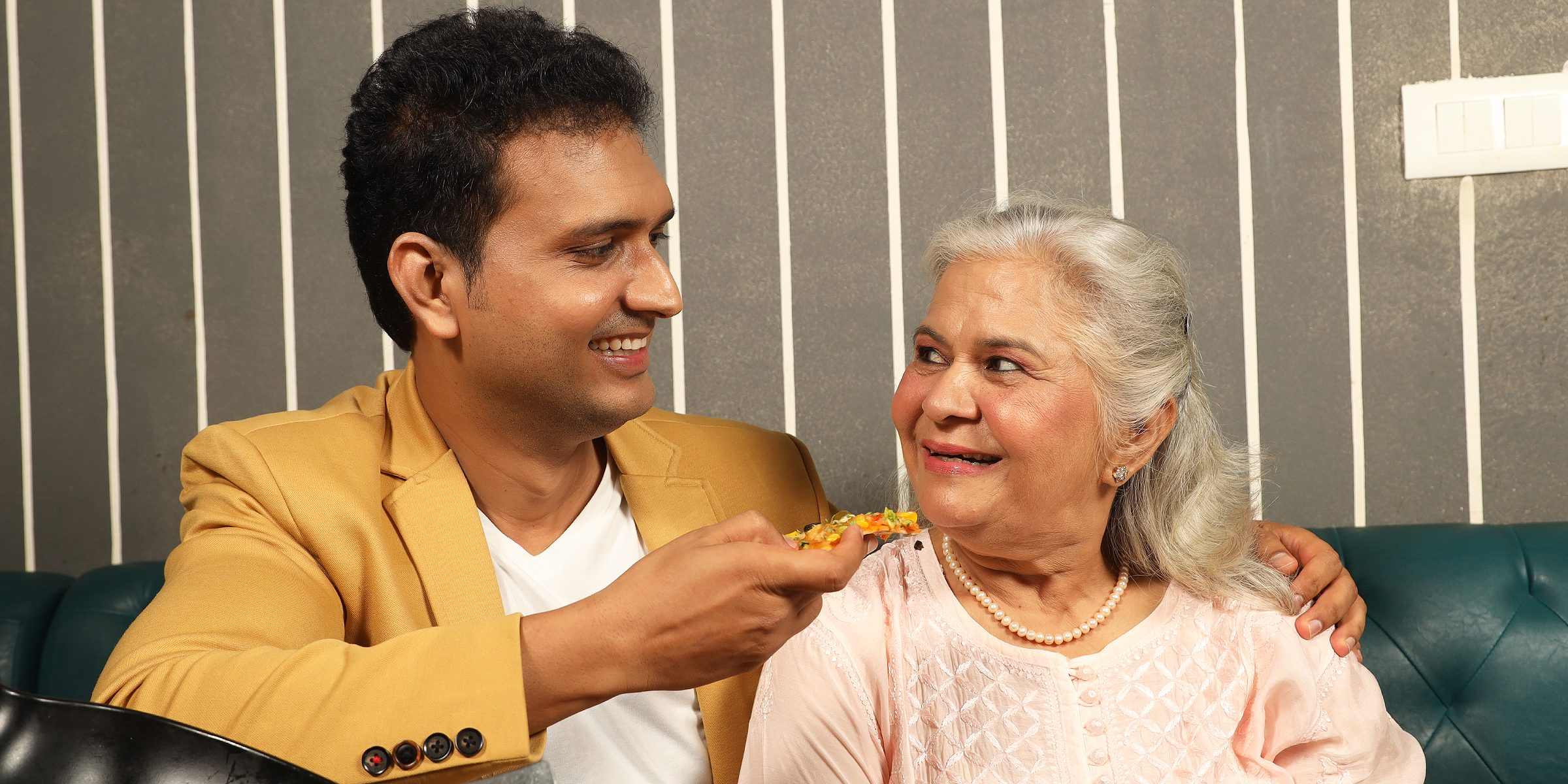 Mother and son eating pizza. For illustration purposes only | Source: Shutterstock
