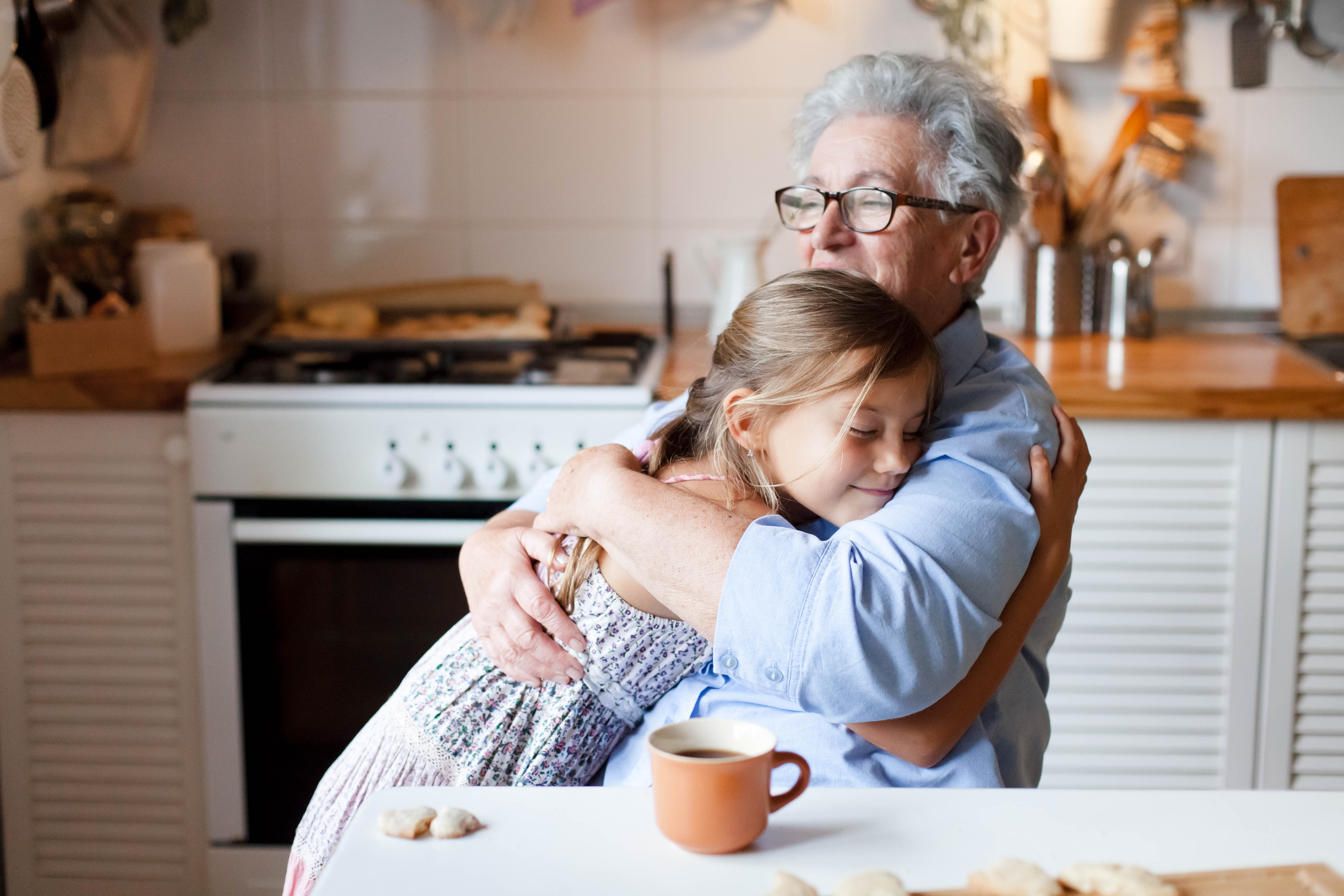 Grandmother hugging her granddaughter | Source: Shutterstock