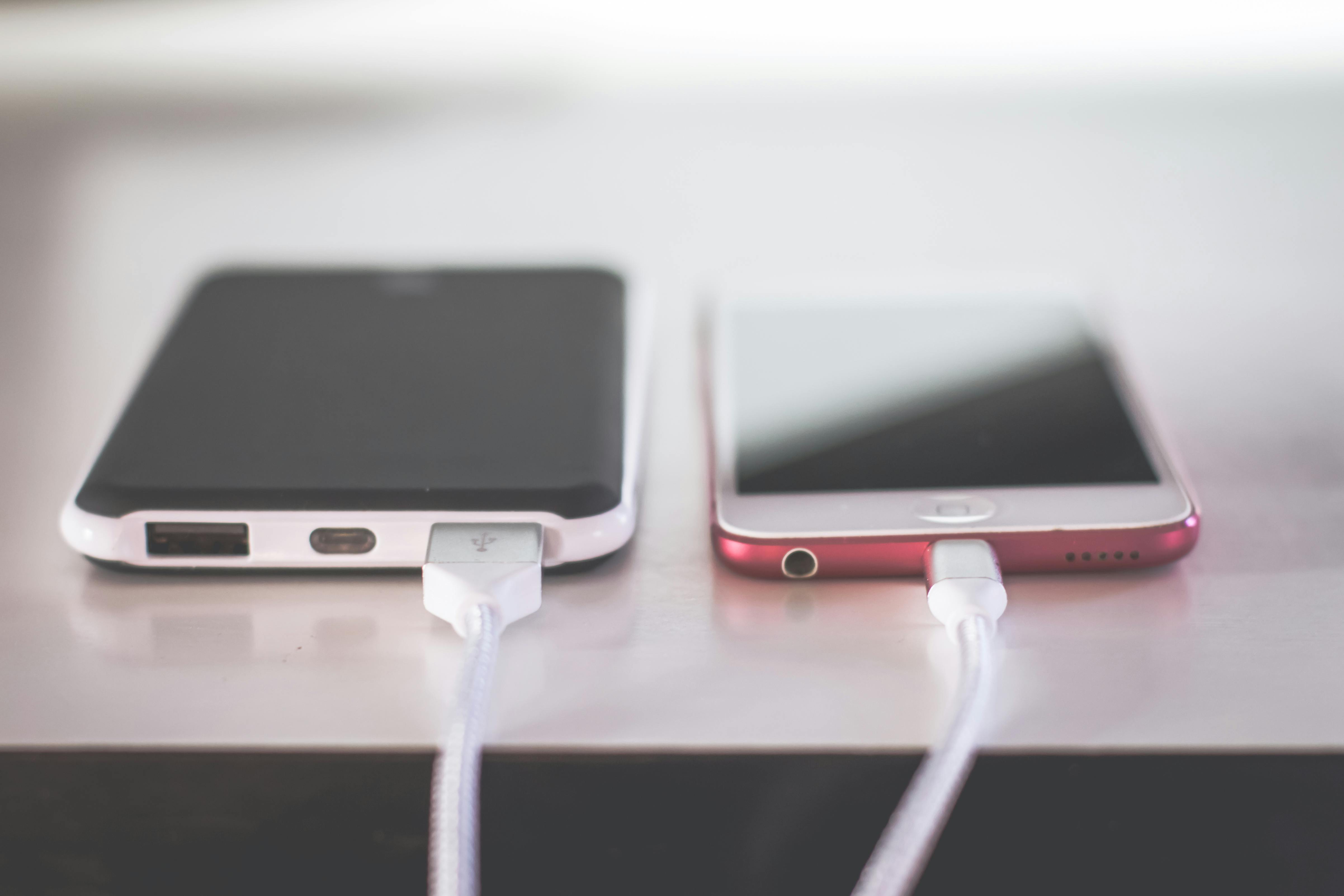 Two phones charging | Source: Pexels