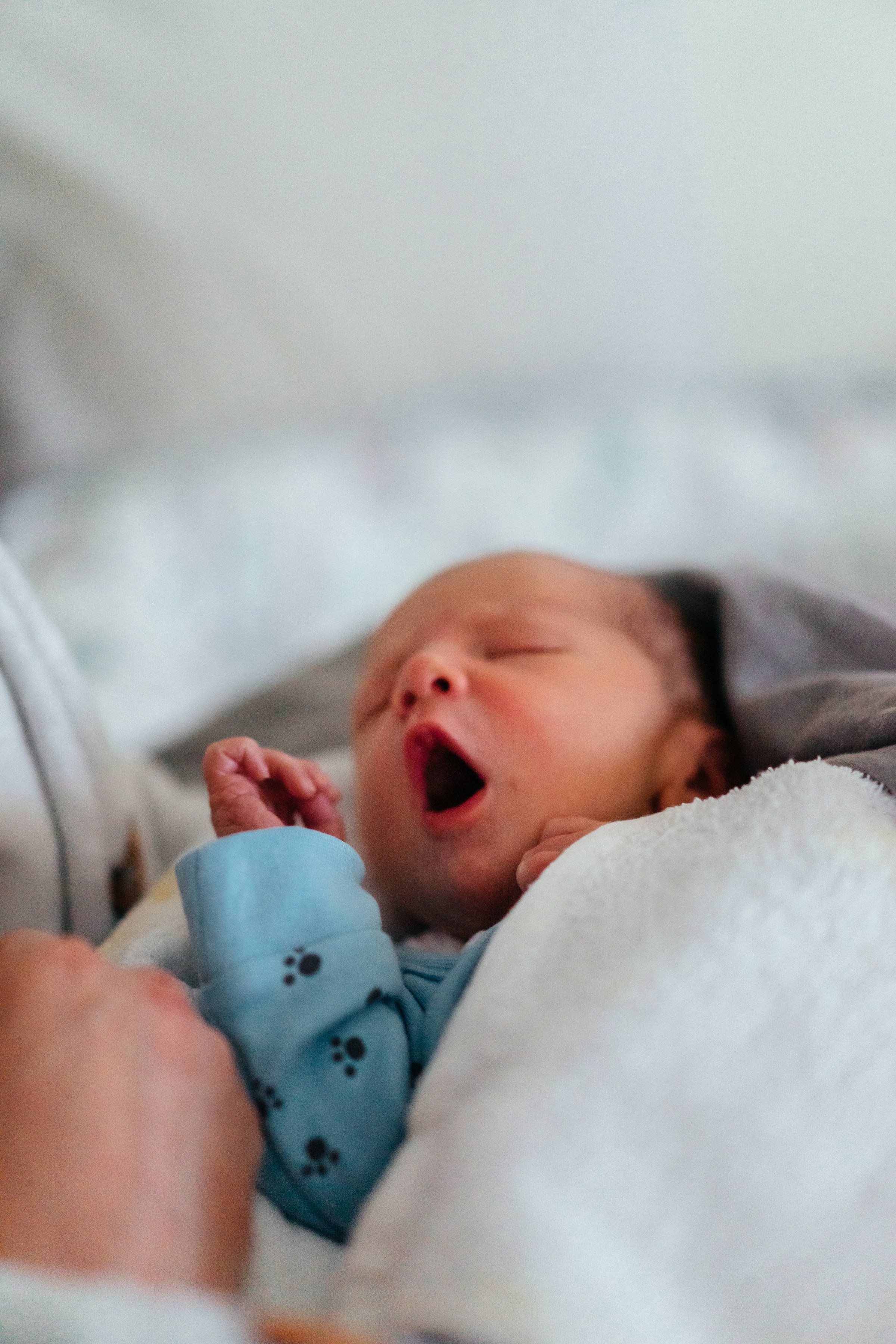 A newborn baby yawning | Source: Unsplash