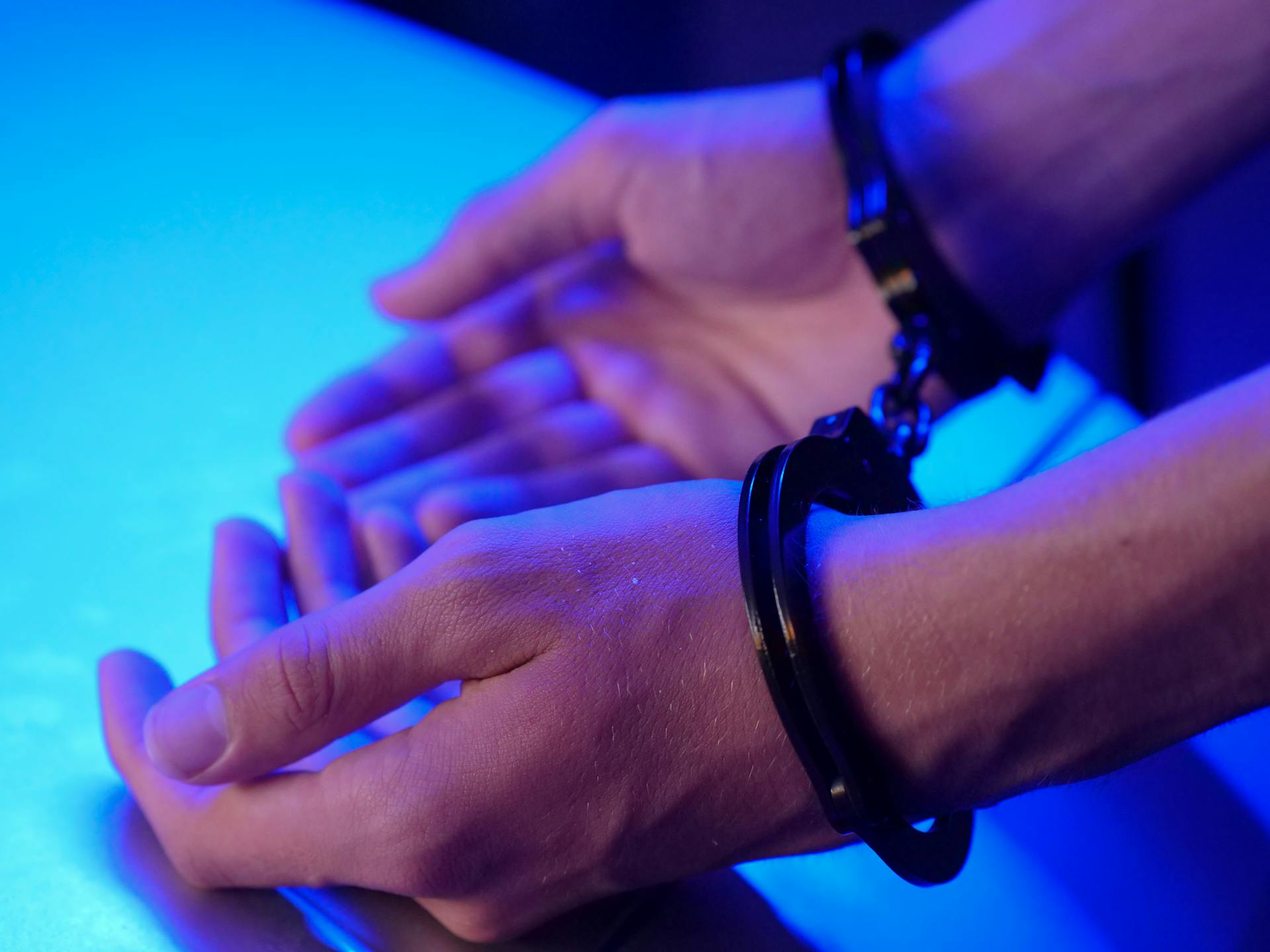 A man in handcuffs | Source: Pexels