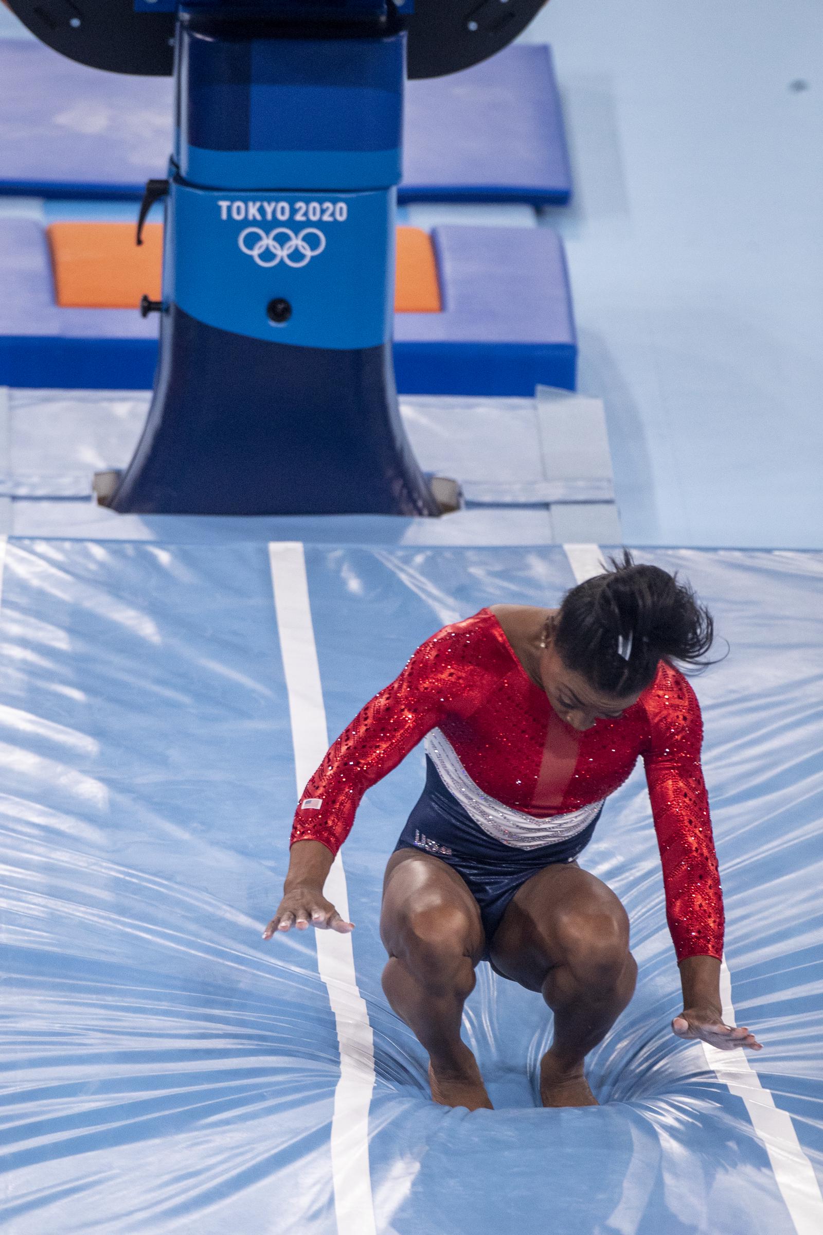 Simone Biles performs on the vault apparatus where she lands awkwardly during the Women's Team final at the Tokyo 2020 Summer Olympic Games in Tokyo, Japan, on July 27, 2021. | Source: Getty Images