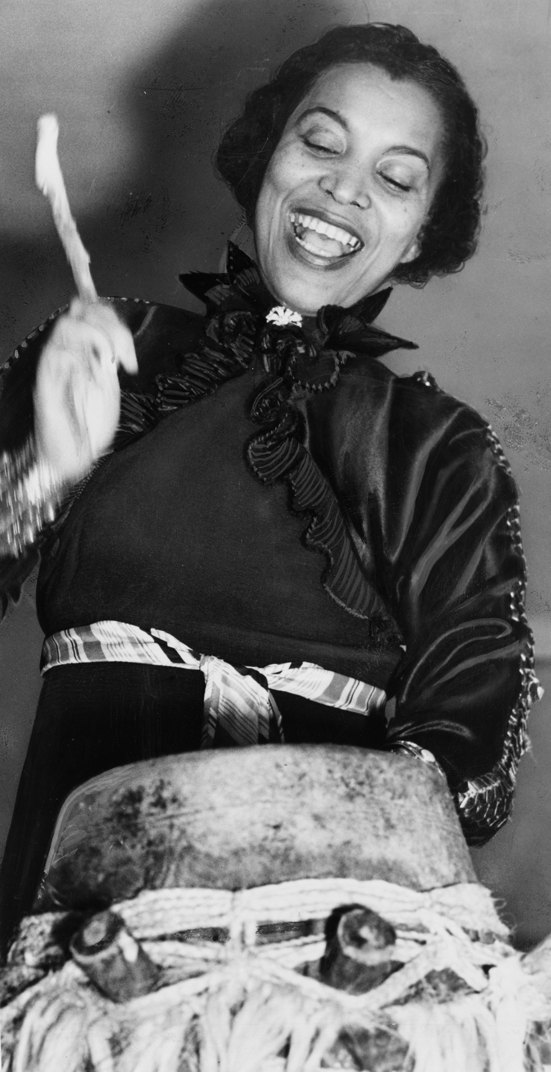 Zora Neale Hurston beating the hountar or mama drum, circa 1937 | Photo: WikiMedia Commons Images