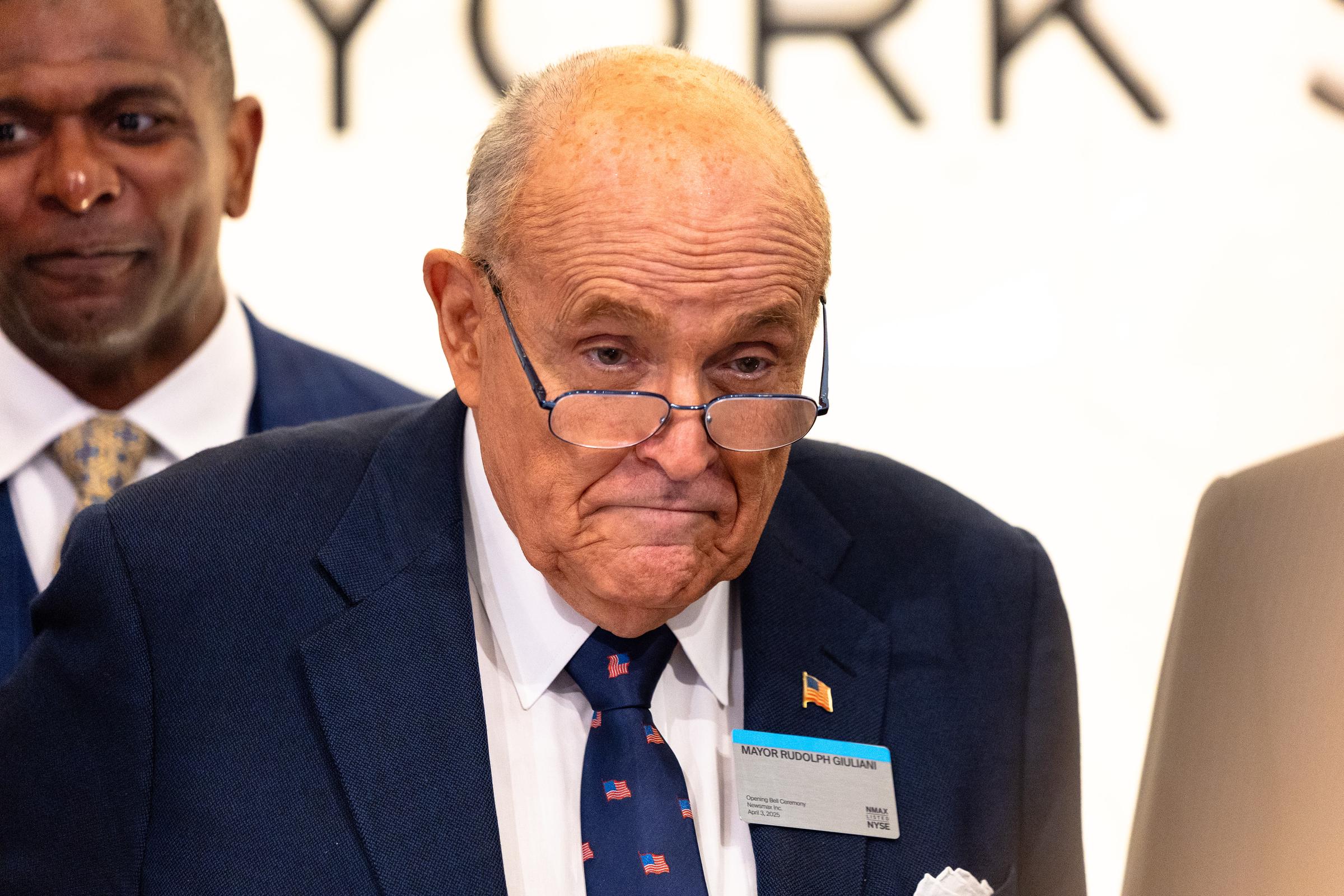 Rudy Giuliani accompanies Chris Ruddy, CEO of Newsmax, for the ringing the opening bell at the New York Stock Exchange during morning trading on April 3, 2025 in New York City | Source: Getty Images