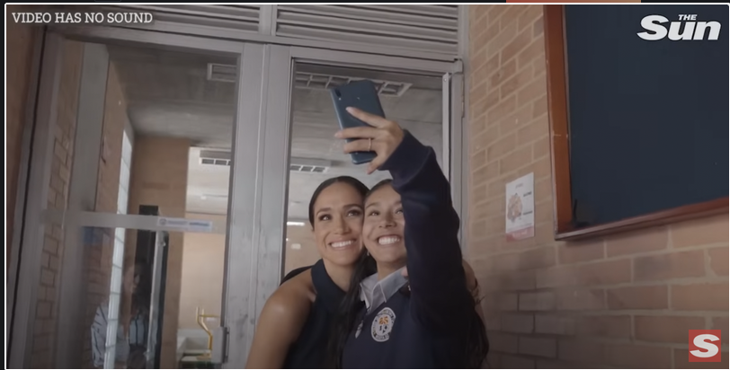 Meghan Markle and a student during her visit to a local charter school, Colegio Cultura Popular, in Bogota, Colombia, from a YouTube video dated August 16, 2024 | Source: Youtube/@thesun