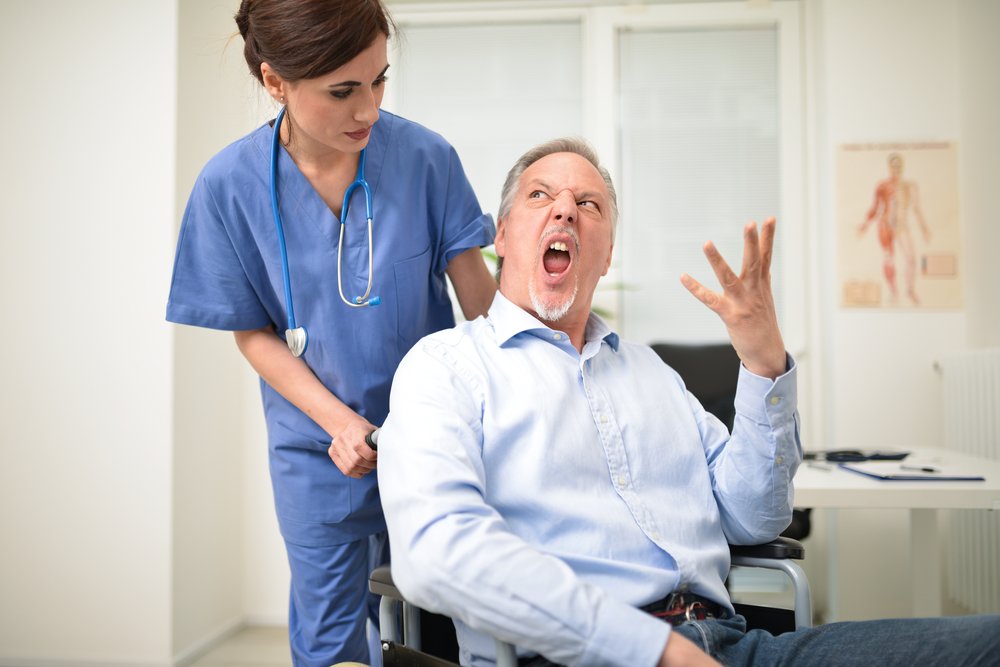 A photo of a man in an hospital displaying anger | Photo: Shutterstock