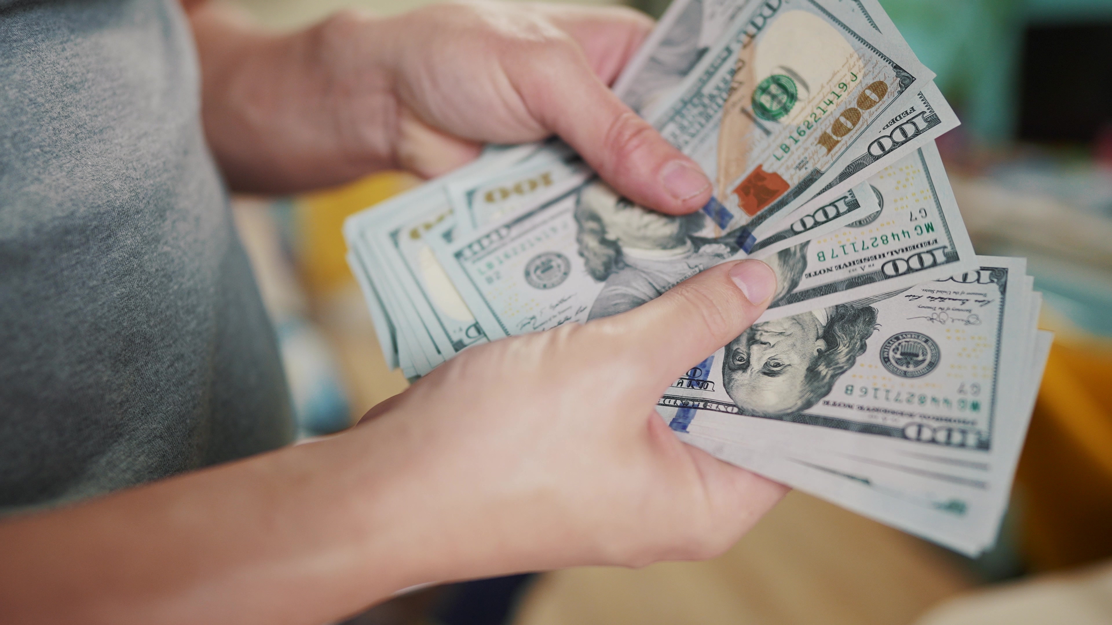 A person holding money | Source: Shutterstock
