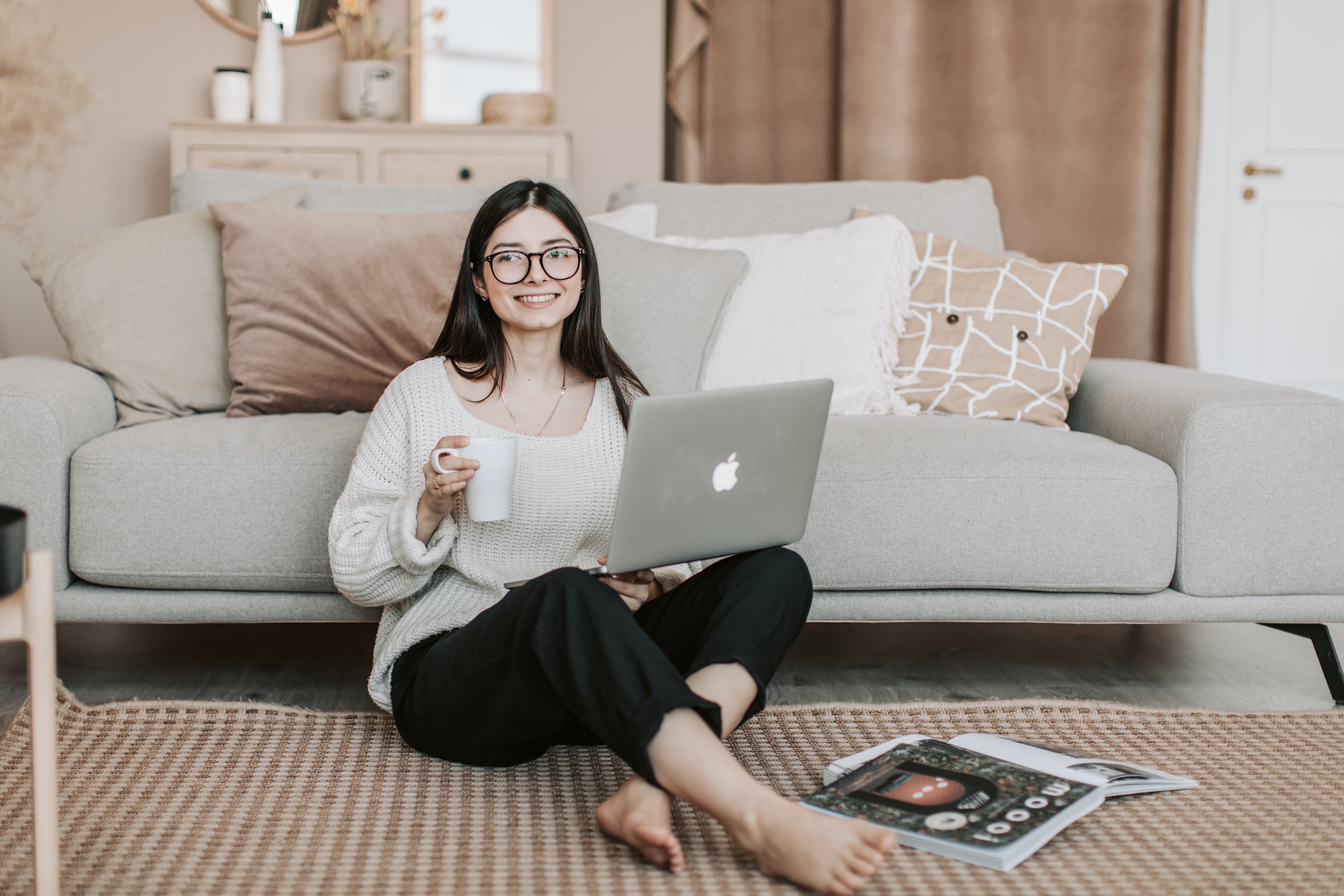 A woman using her laptop at home. | Source: Pexels
