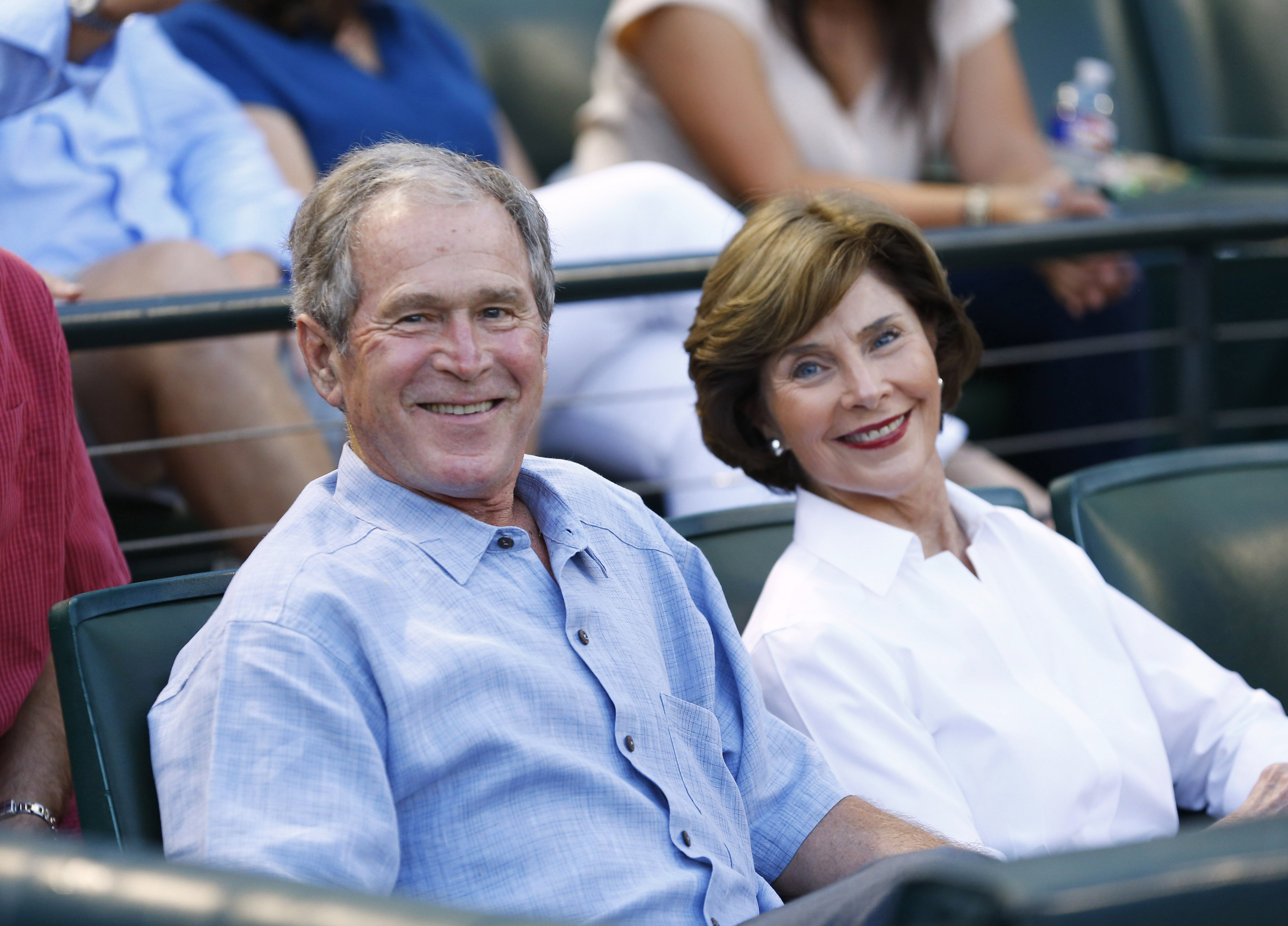 Former U.S. president George W. Bush and former First Lady Laura Busy wait for the start of the game between the Seattle Mariners and the Texas Rangers at Globe Life Park in Arlington on September 19, 2015 in Arlington, Texas | Source: Getty Images 