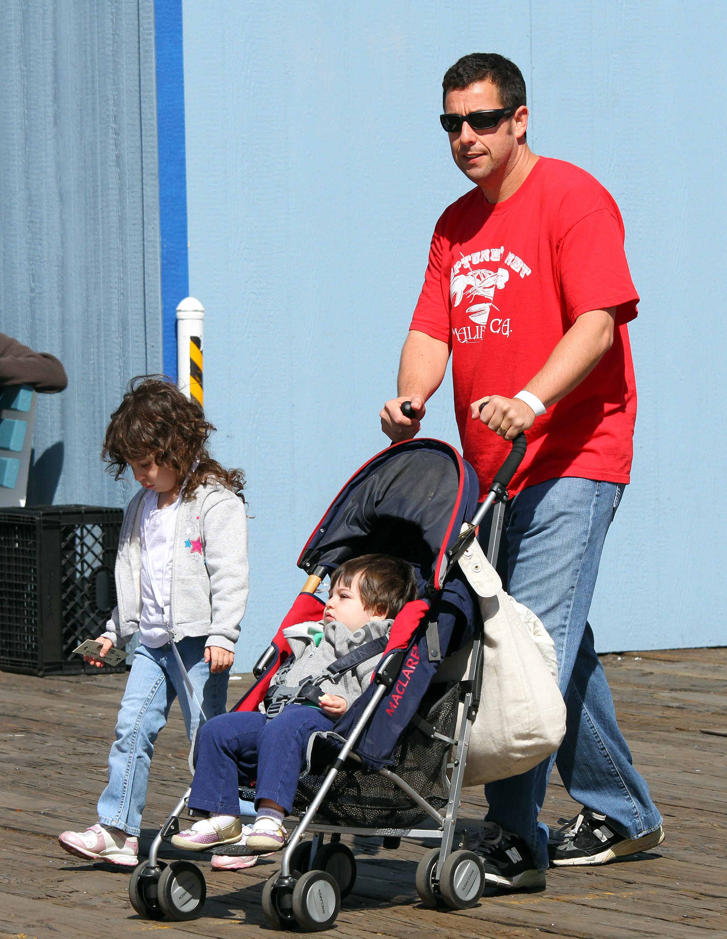 Adam, Sunny, and Sadie Sandler on a stroll in California on March 14, 2010. | Source: Getty Images