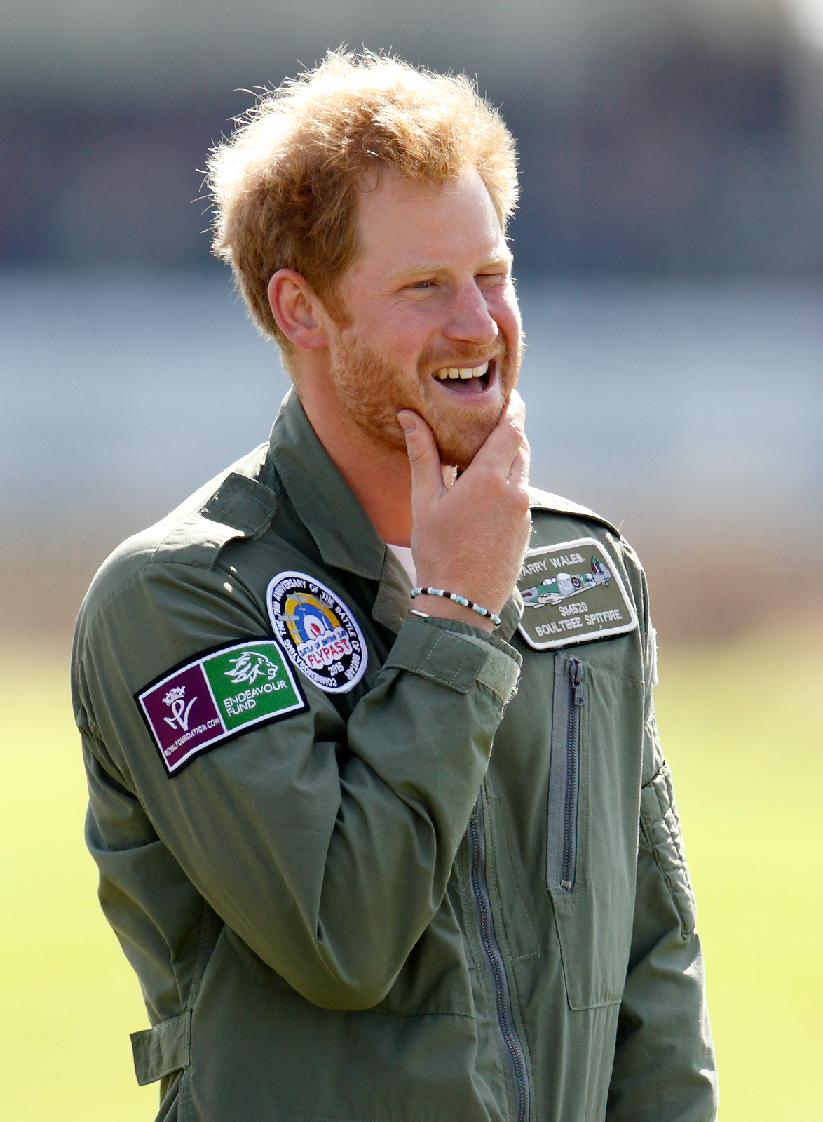 Prince Harry watches Spitfires take off on the airfield at Goodwood Aerodrome on September 15, 2015 in Chichester, England. | Source: Getty Images