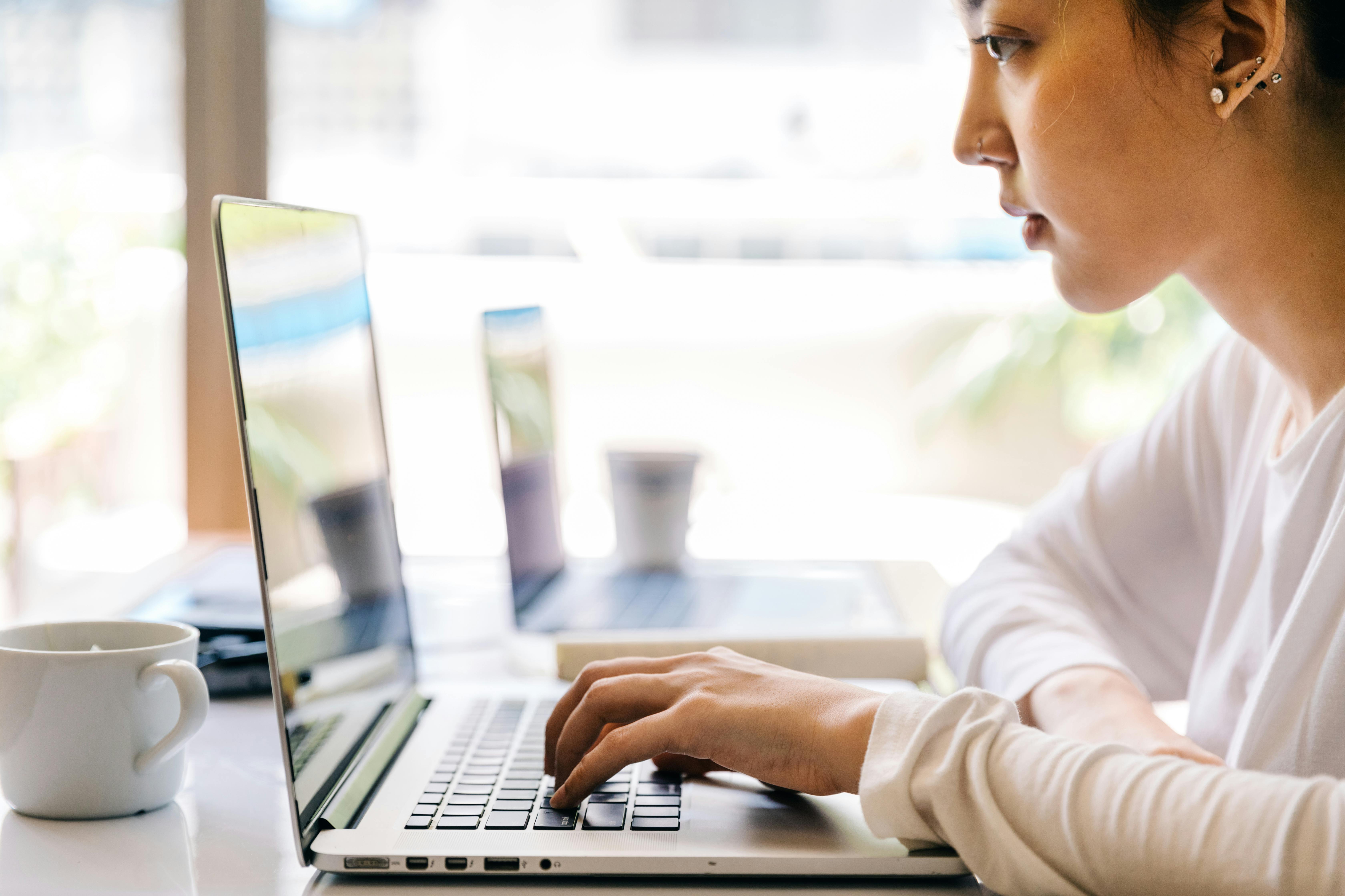 A woman looking at something on a laptop computer | Source: Pexels