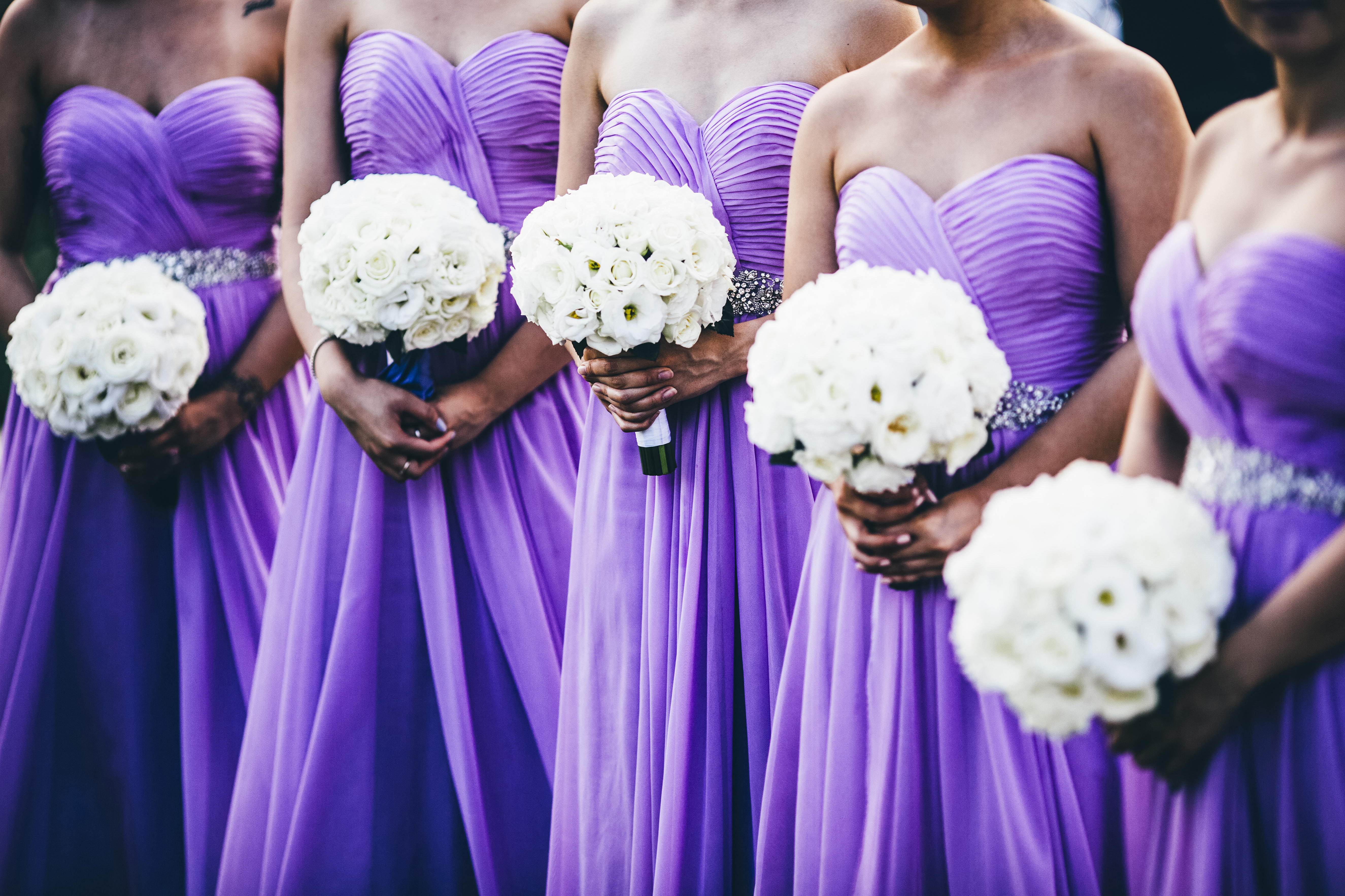 Bridesmaids wearing purple dresses | Source: Getty Images