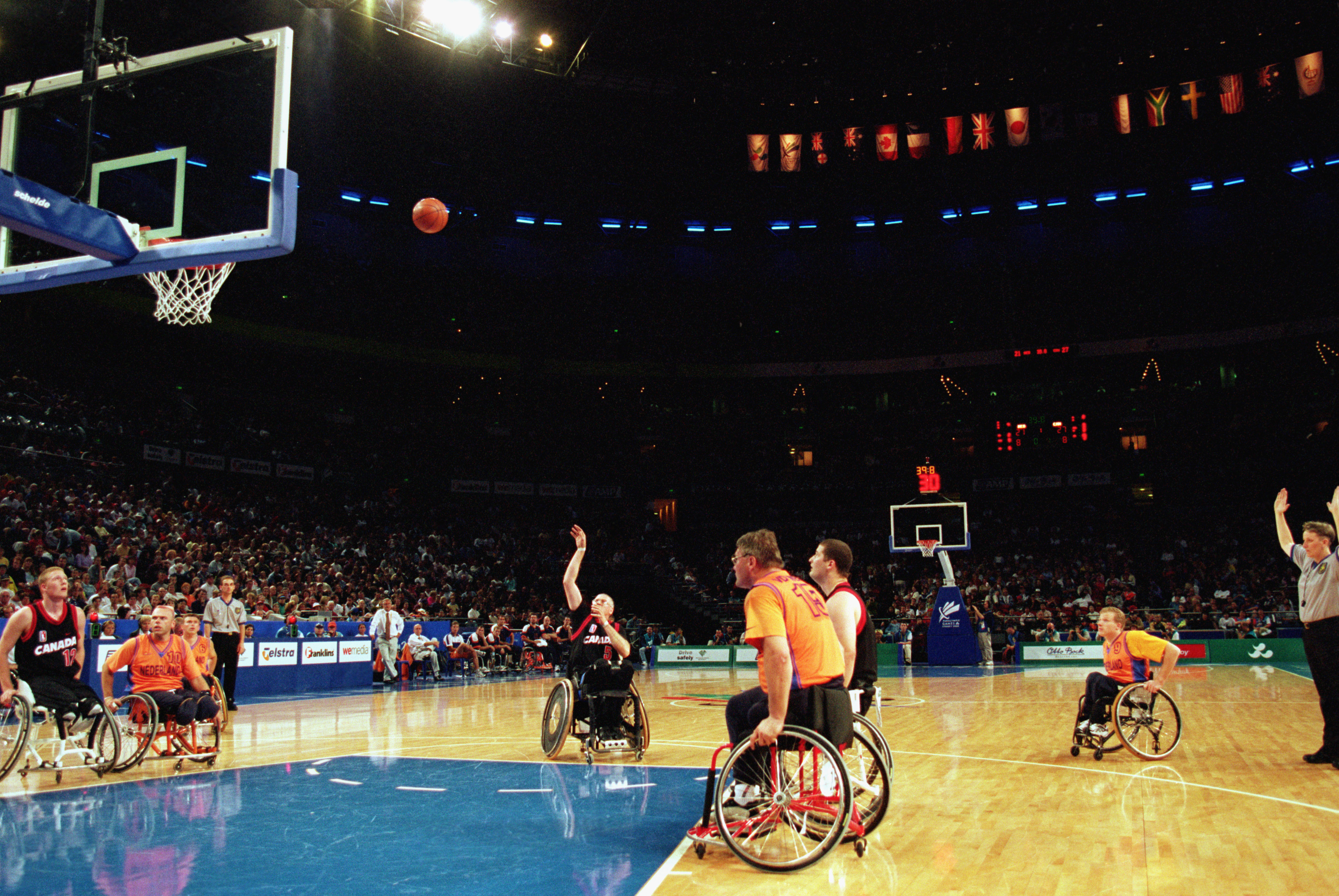 Roy Henderson #5 of Canada shoots during the Men's Wheelchair Basektball Gold Medal Final against Team Netherlands during the Sydney 2000 Paralympic Games on October 28, 2000 at Sydney Superdome in Sydney, Australia | Source: Getty Images