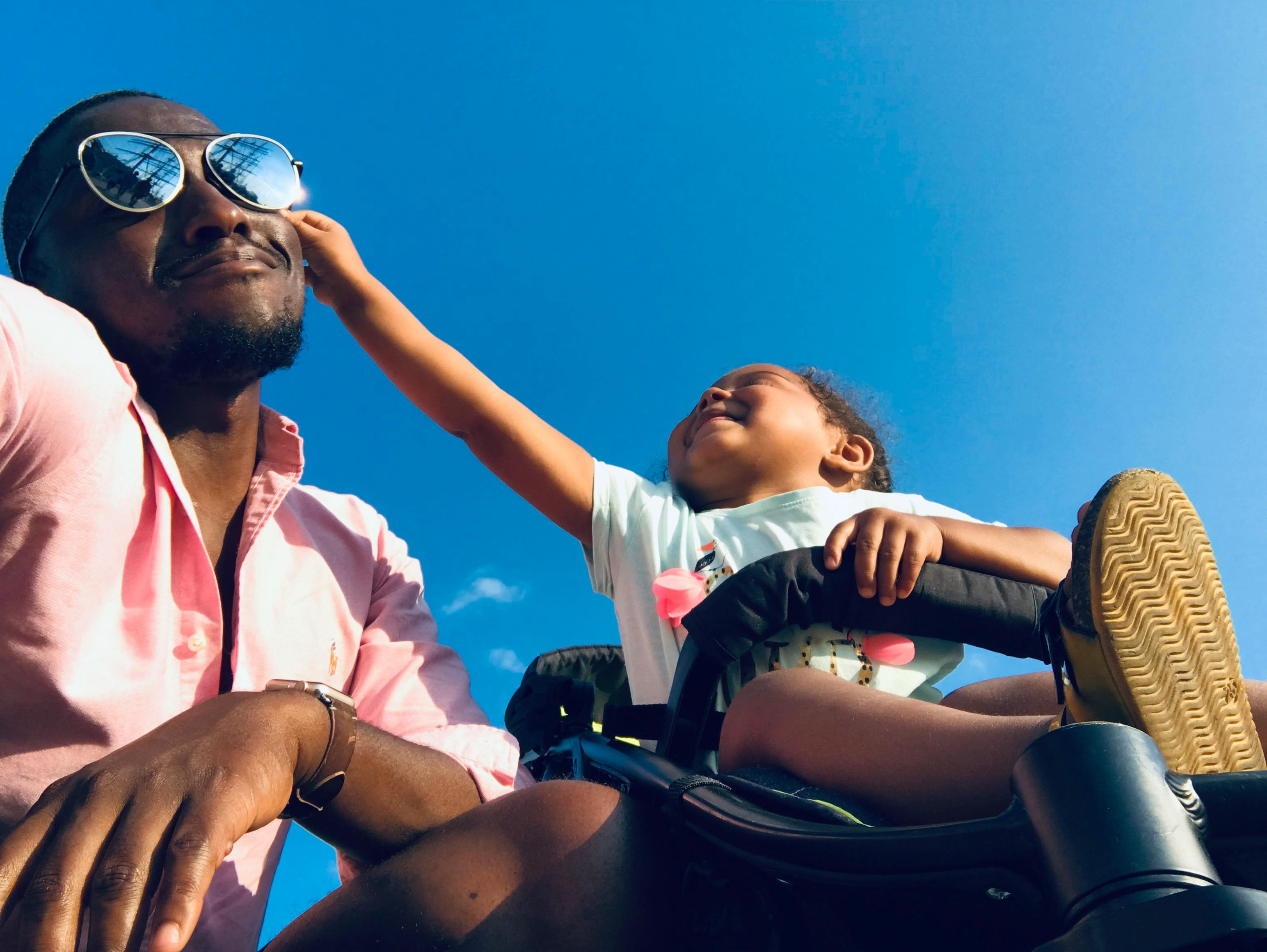 A man with his son in a stroller | Source: Pexels