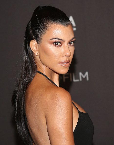 Kourtney Kardashian Looks Hot in Sultry Low-Back Emerald Gown While Cooking  in the Kitchen