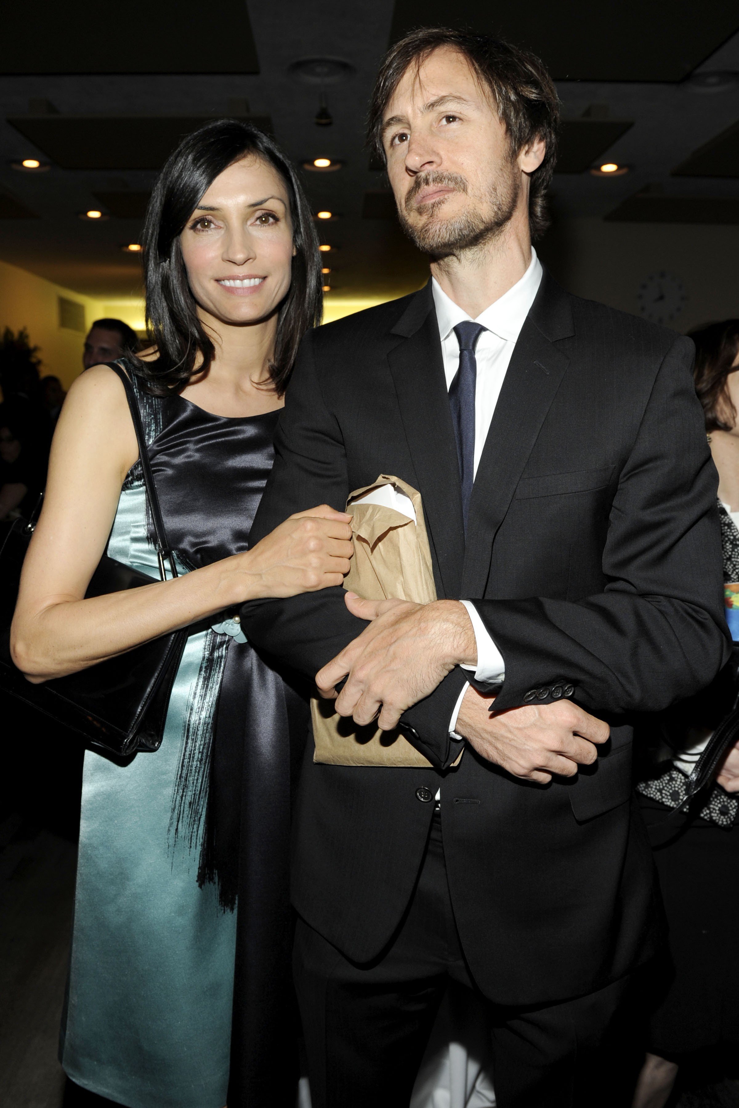Famke Janssen and Cole Frates at on art sale and exhibition on May 12, 2009, in New York City. | Source: Getty Images