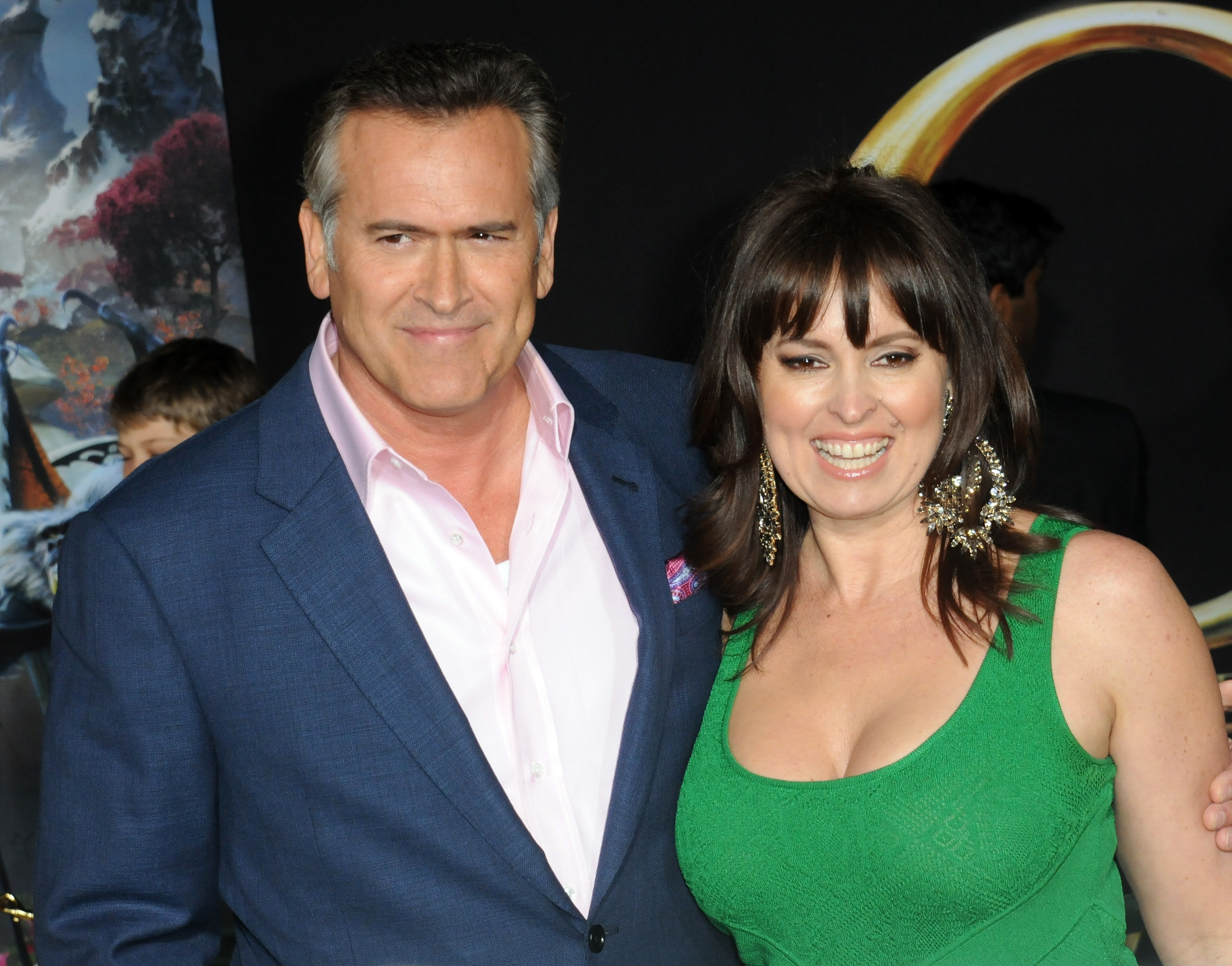 Bruce Campbell and wife Ida Gearon attend the premiere of "Oz the Great and Powerful" in Hollywood, California, on October 6, 2013 | Source: Getty Images