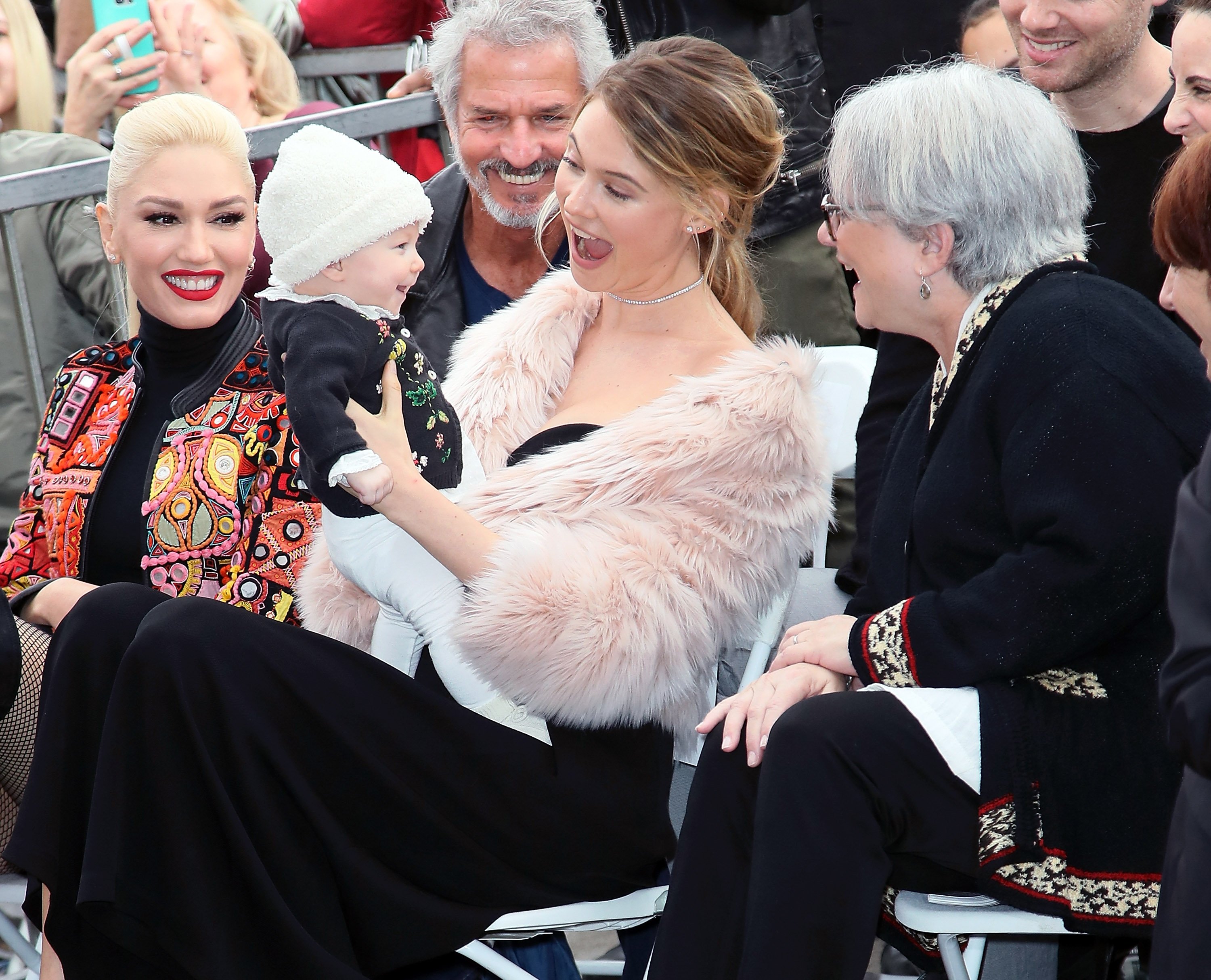 (From L-R) Singer Gwen Stefani, Behati Prinsloo with her daughter, and Patsy Noah are pictured in attendance of Adam Levine being honored with a Star on the Hollywood Walk of Fame on February 10, 2017 in Hollywood | Source: Getty Images