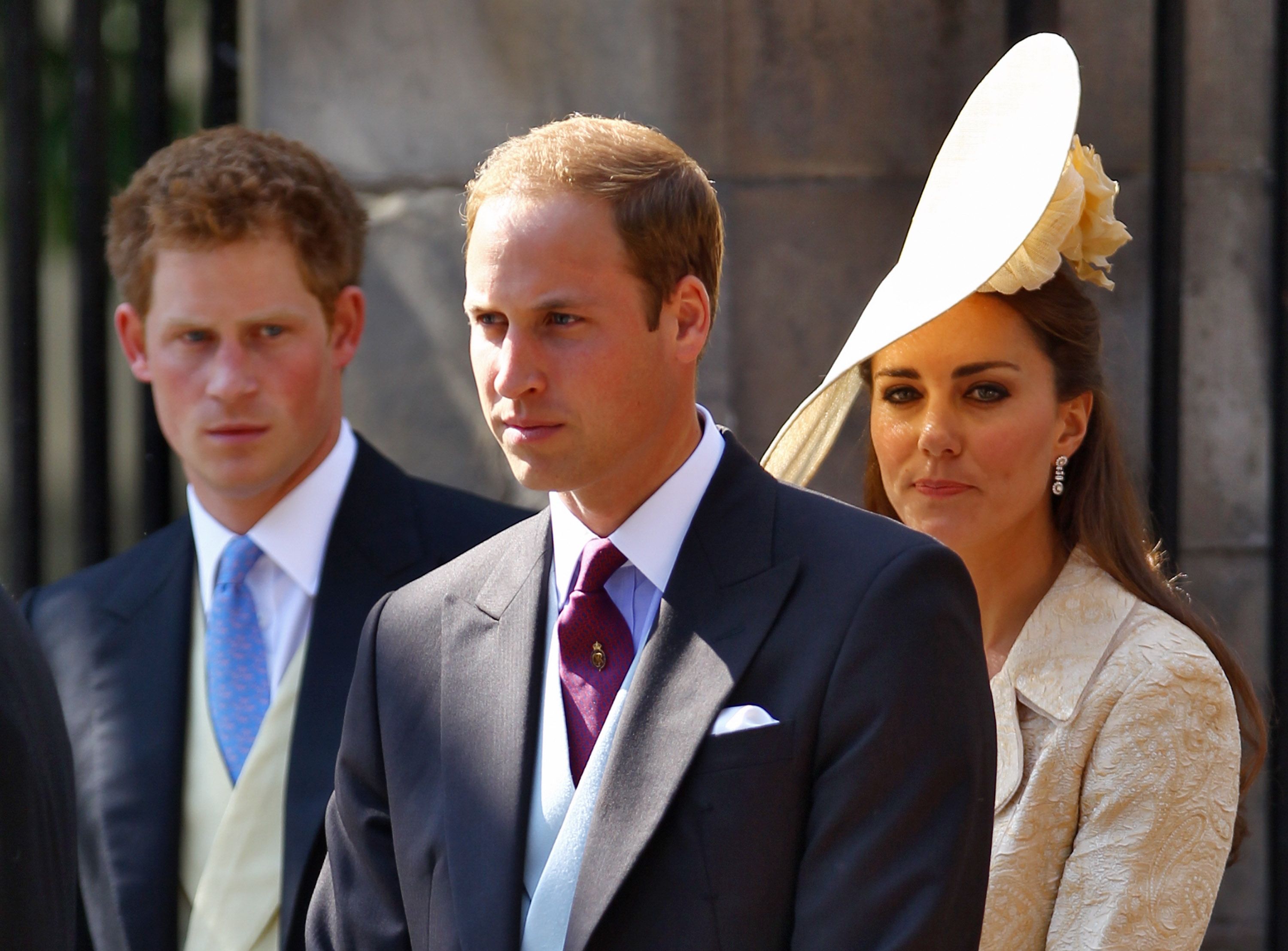 Prince Harry, Prince William, and Duchess Kate depart after the royal wedding of Zara Phillips and Mike Tindall on July 30, 2011, in Edinburgh, Scotland | Photo: Jeff J Mitchell/Getty Images