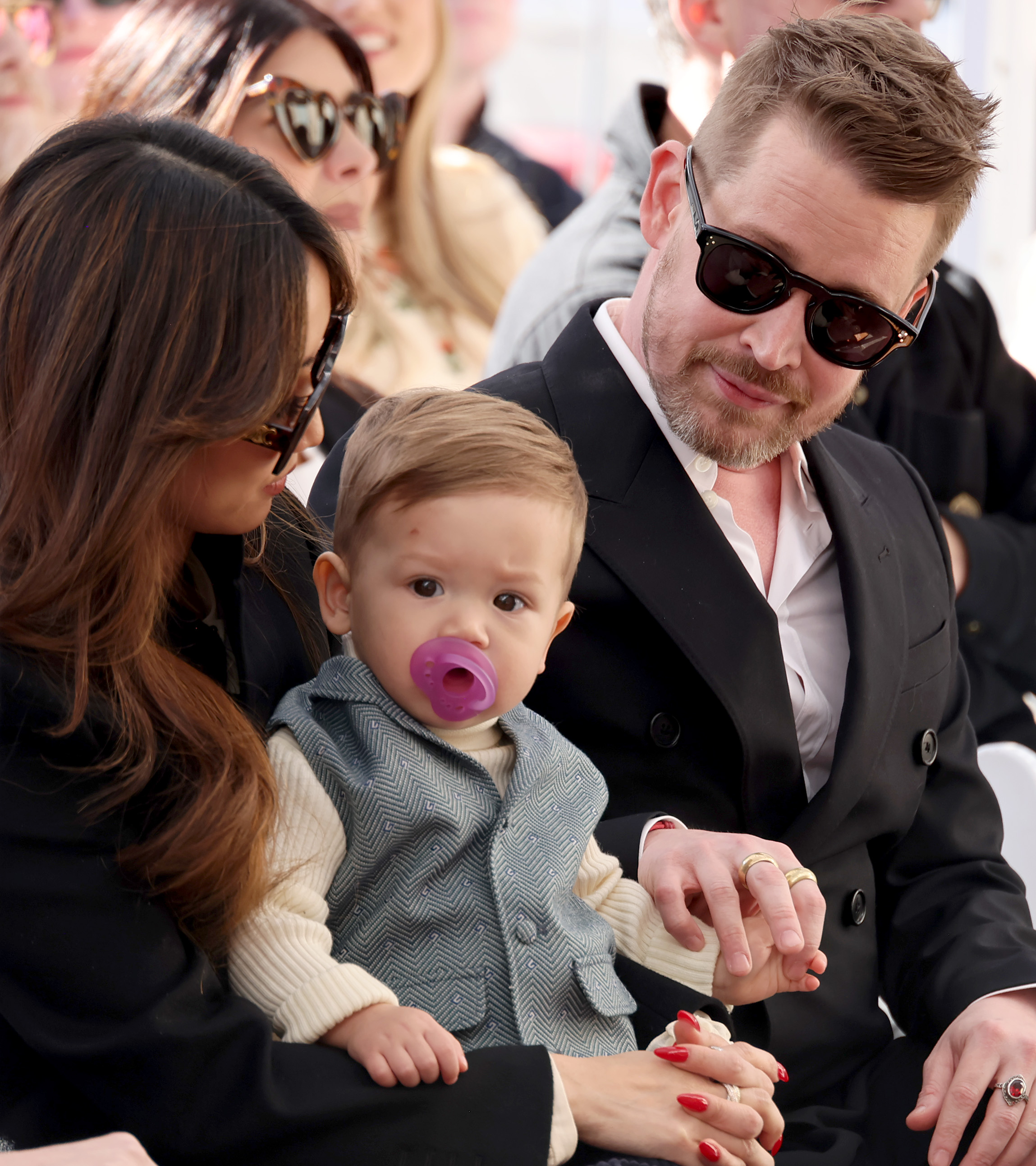 Brenda Song and Macaulay Culkin with their youngest son at Macaulay Culkin's Hollywood Walk of Fame star ceremony in Hollywood, California on December 1, 2023 | Source: Getty Images