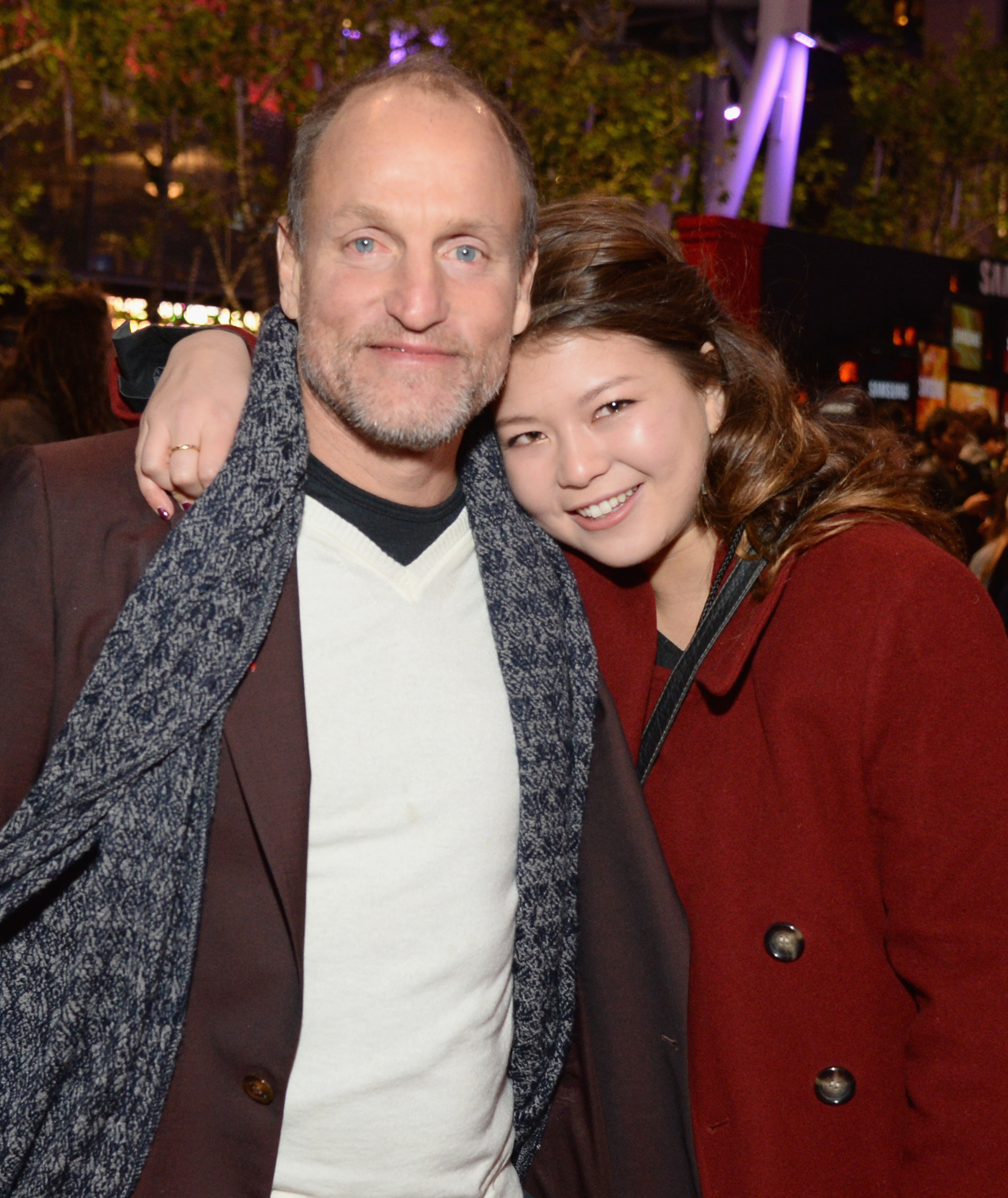 Woody Harrelson and his daughter Zoe Harrelson at the "Hunger Games: Mockingjay Part 2" Los Angeles premiere on November 16, 2015, in California | Source: Getty Images