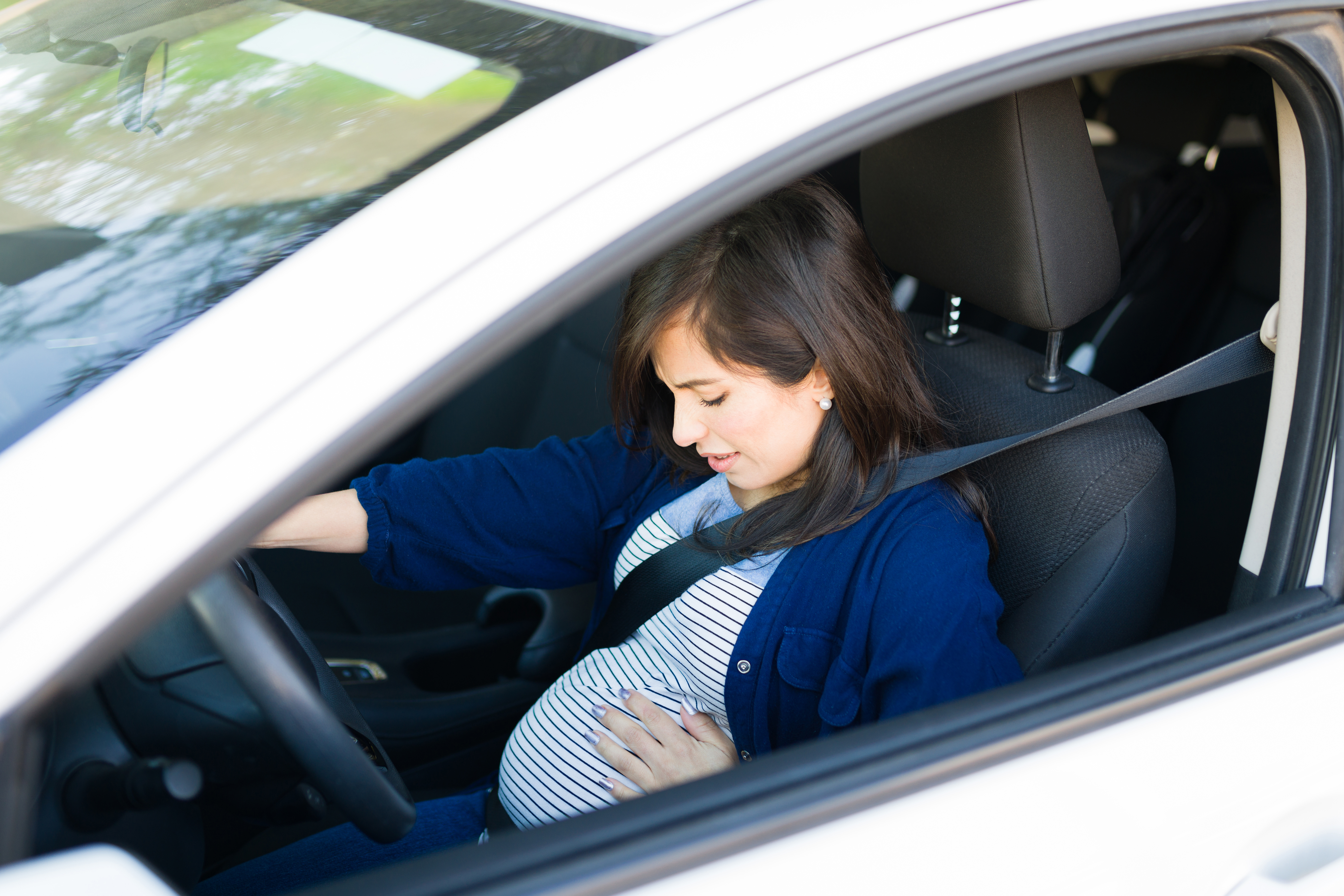 Pregnant woman in her car | Source: Getty Images