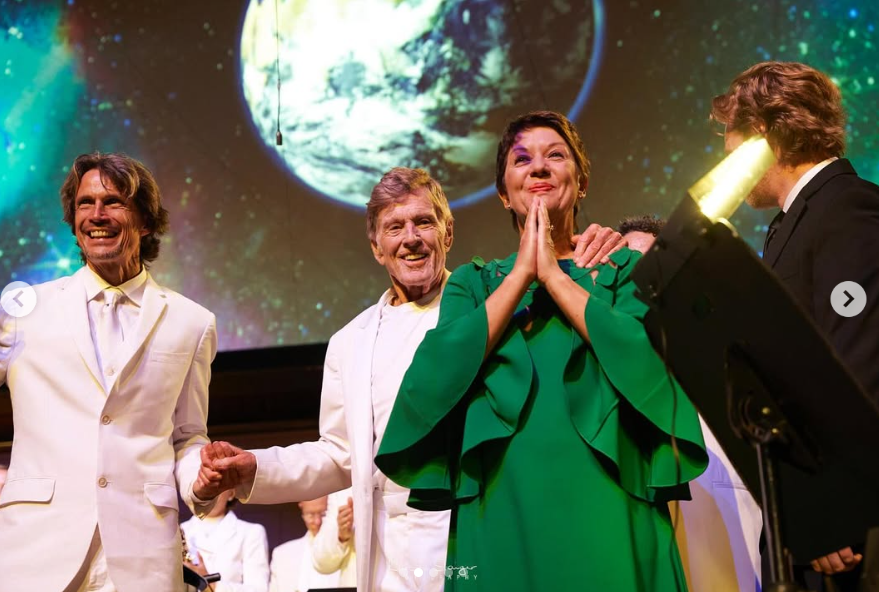 Robert Redford and Sibylle Szaggars are pictured on stage in October 2022 | Source: Instagram/sibylleszaggarsredfordfineart