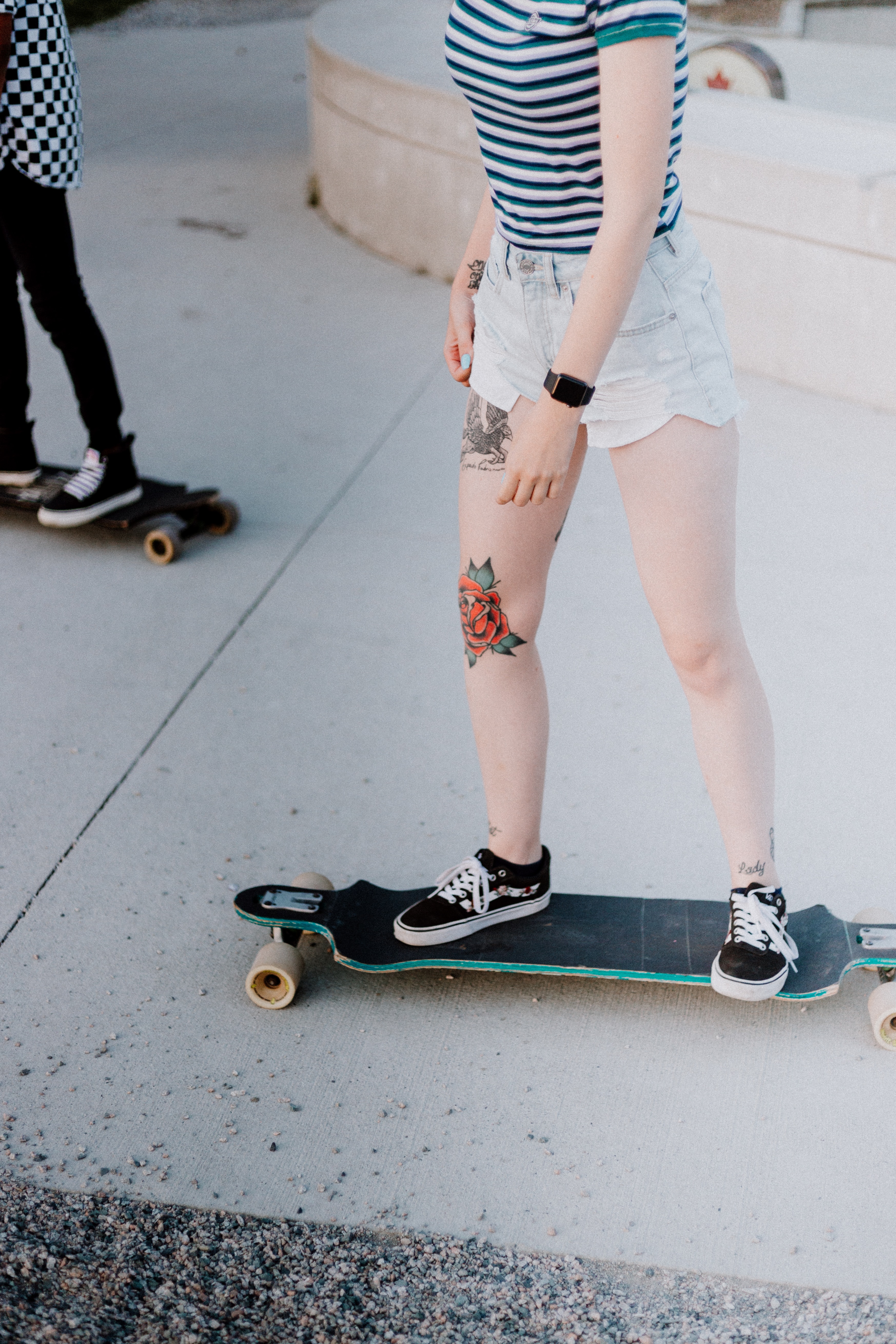 A photo of two people on skateboards | Source: Unsplash