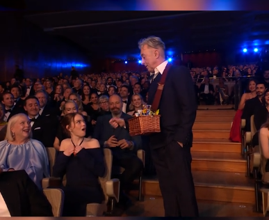 Alan Cumming giving a snack to Emma Stone at the 79th BAFTA Film Awards dated February 22, 2026 | Source: TikTok/bbc