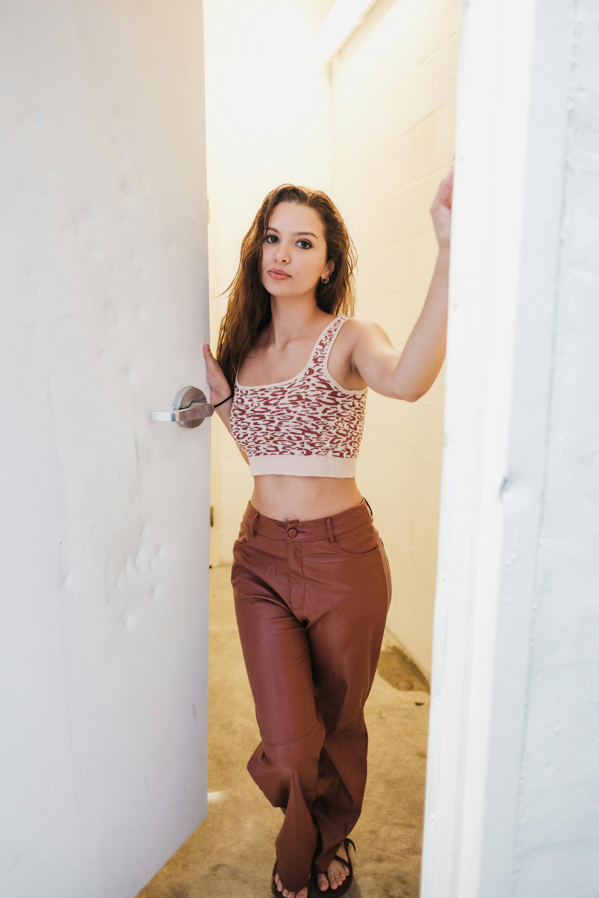 A woman opening a door | Source: Pexels