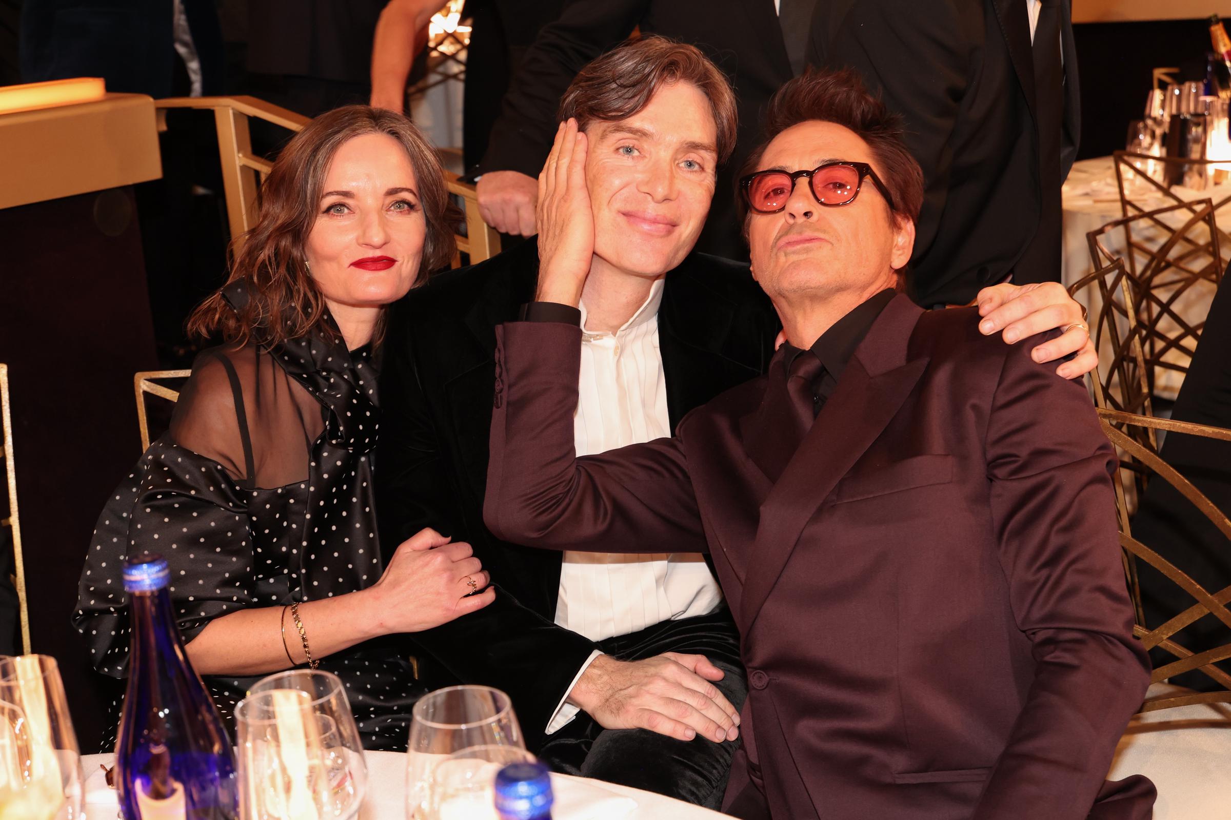 Yvonne McGuinness, Cillian Murphy, and Robert Downey Jr. at the 81st Golden Globe Awards held at the Beverly Hilton Hotel on January 7, 2024 in Beverly Hills, California | Source: Getty Images