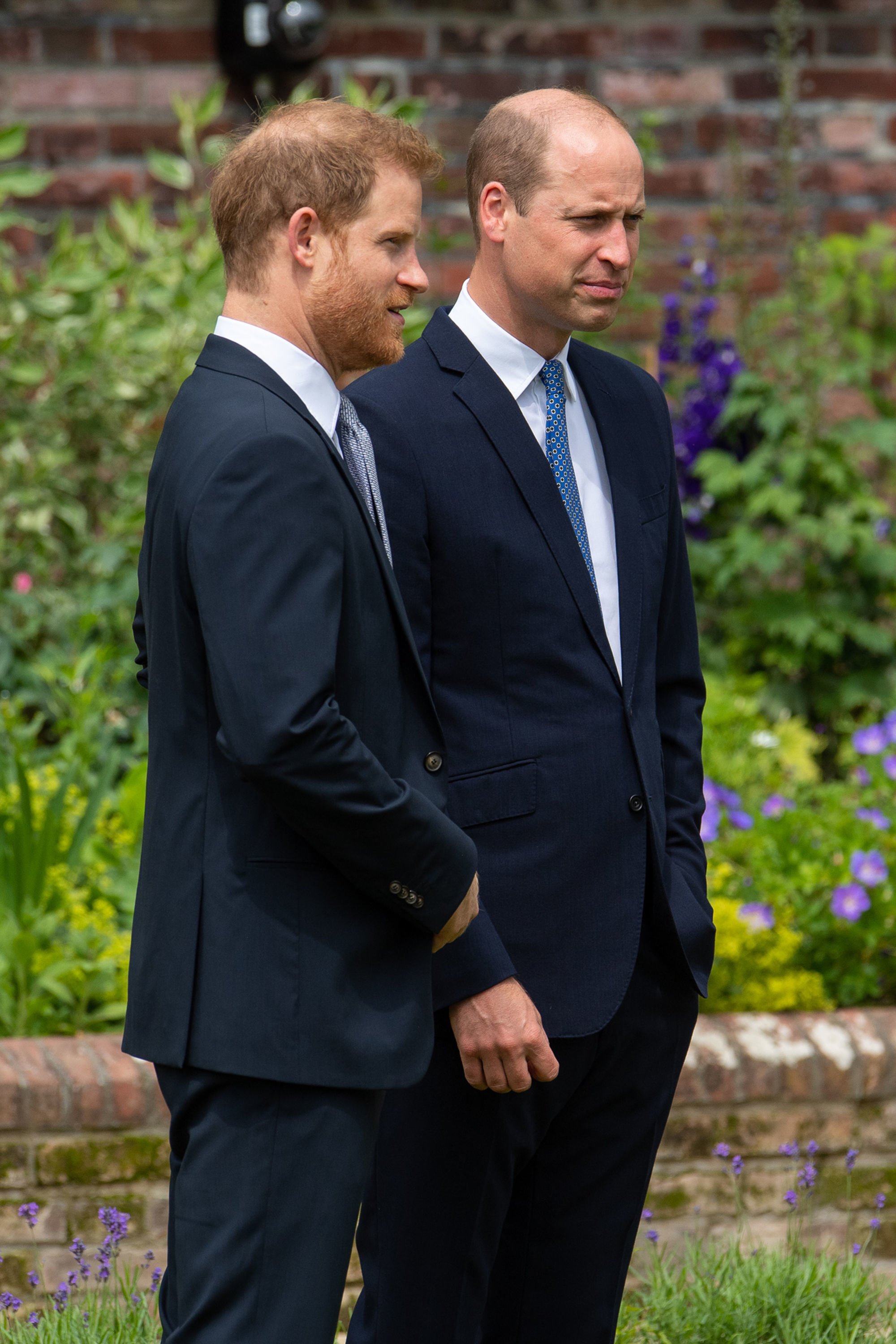 Prince Harry and Prince William during the unveiling of a statue they commissioned of their mother Diana, Princess of Wales, in the Sunken Garden at Kensington Palace, on what would have been her 60th birthday on July 1, 2021, in London, England. | Source: Getty Images