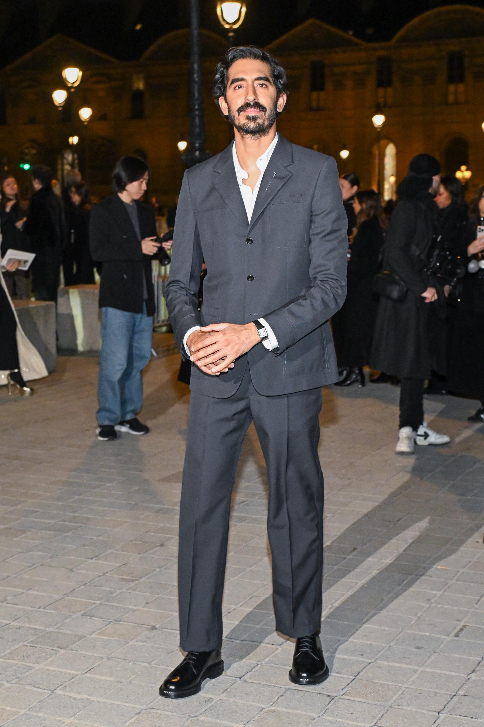 Fast-forward to 2025, and Patel has fully evolved into a seasoned leading man. At a high-profile fashion event in Paris, he wore a tailored slate-gray suit with an open collar, paired with a salt-and-pepper beard and confident stance. Following roles in "Lion" and "The Green Knight," the "Monkey Man" director now commands both screen and spotlight with quiet charisma.