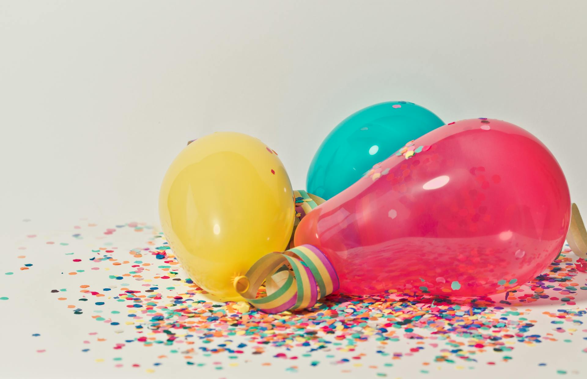Colorful balloons with confetti | Source: Pexels
