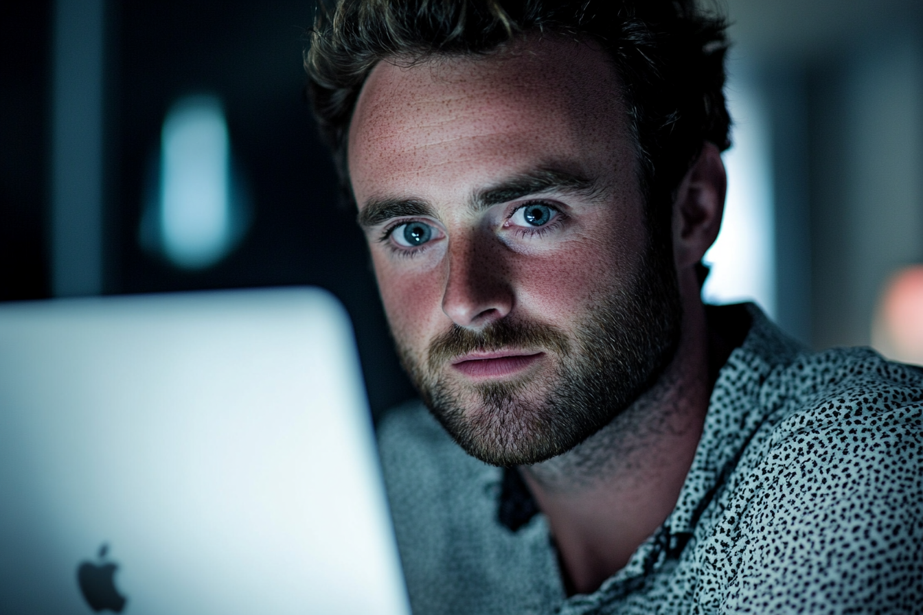 A man using his laptop | Source: Midjourney