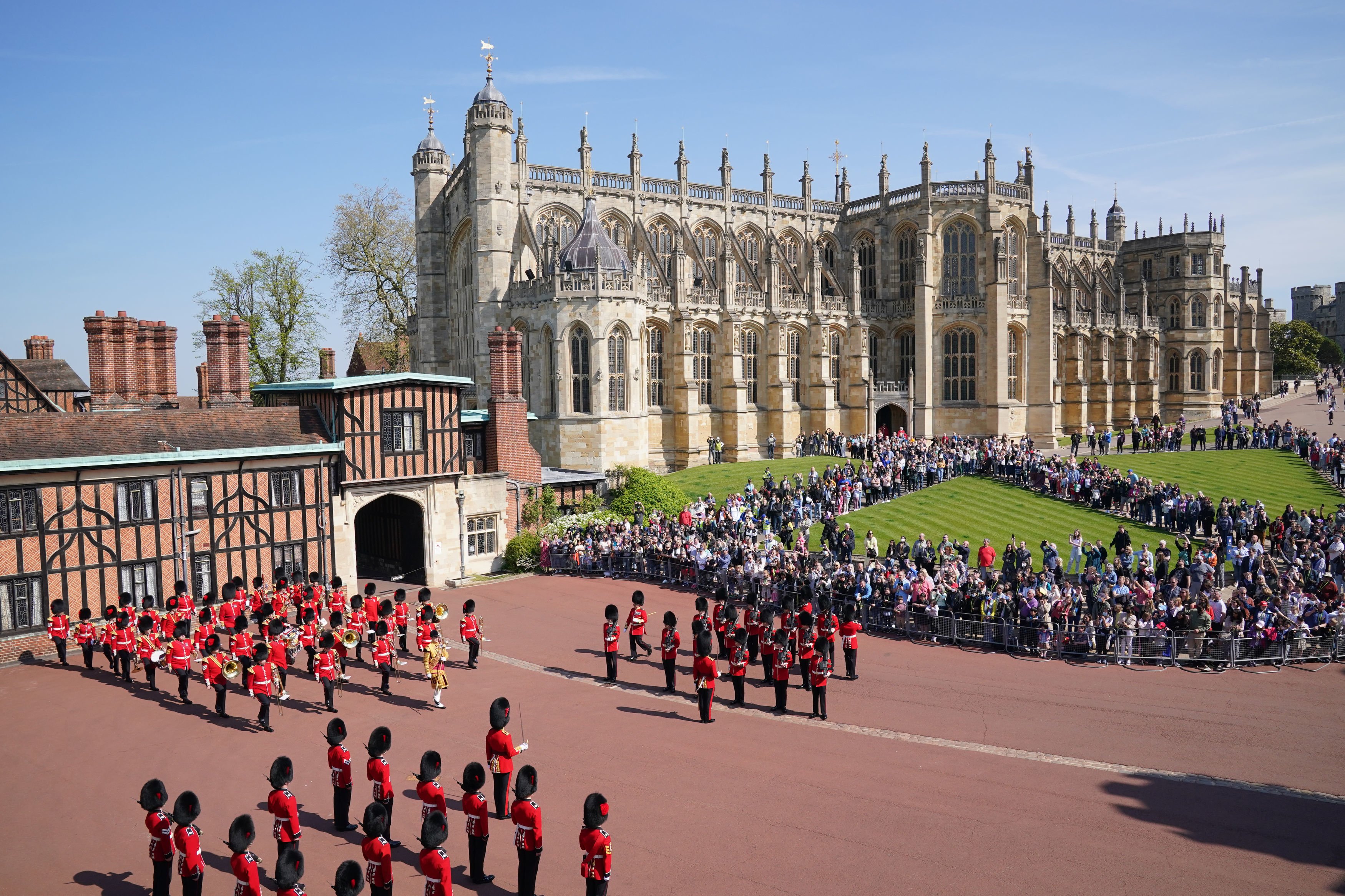 The Band of the Coldstream Guards (top left), play Happy Birthday to mark the 96th birthday of Queen Elizabeth II, alongside the 1st Battalion of the Coldstream Guards, during Changing the Guard at Windsor Castle on April 21, 2022 in London, England. | Source: Getty Images