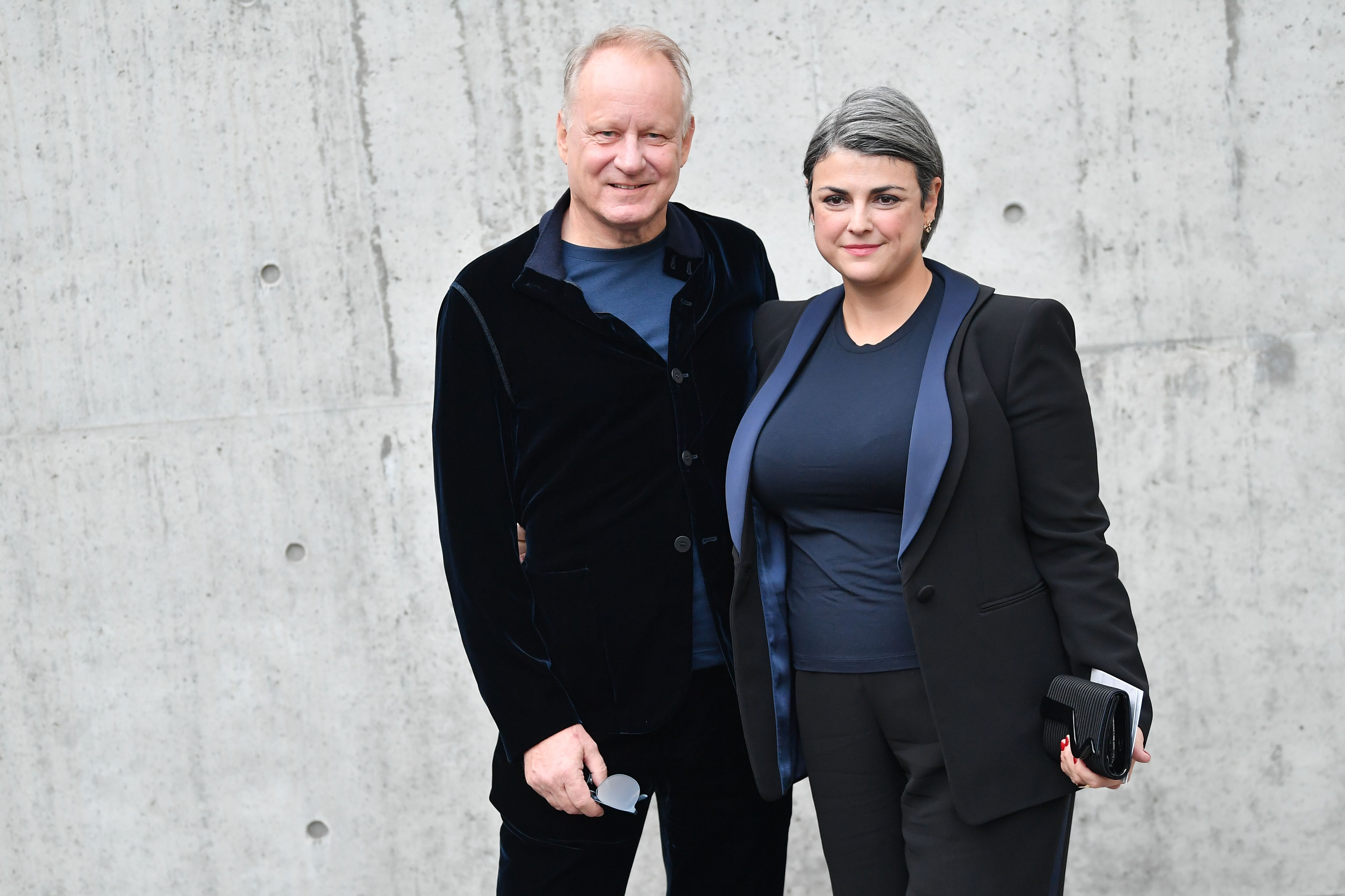 Stellan Skarsgard and Megan Everett at the Giorgio Armani fashion show on January 13, 2020 in Milan, Italy.  |  Source: Getty Images