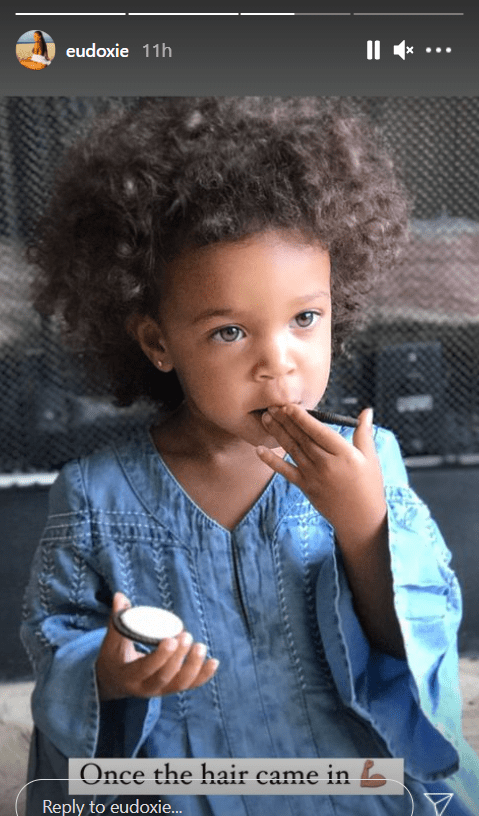 Ludacris' daughter, Cadence, in a denim dress flaunting her full hair | Photo: Instagram/eudoxie