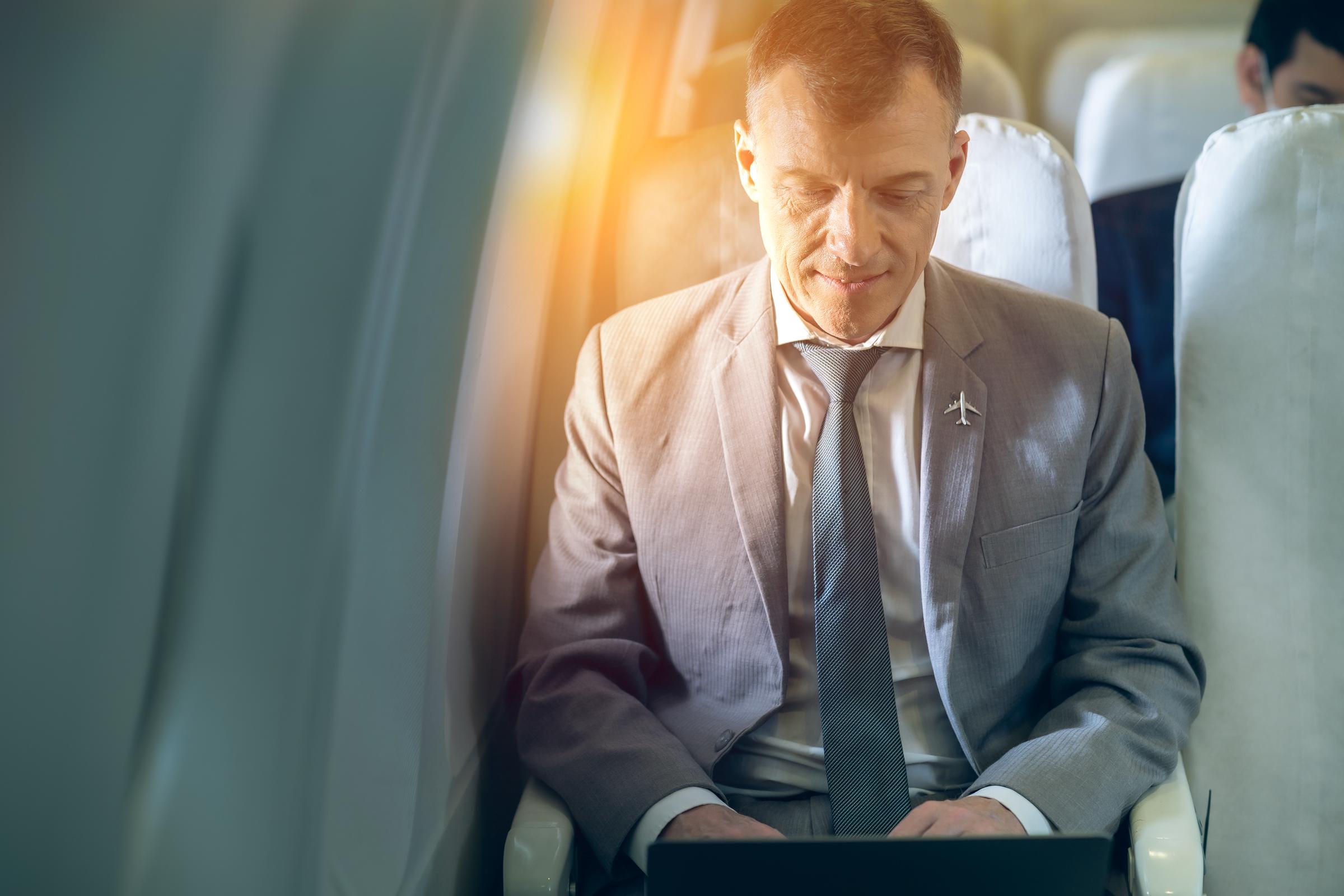 Businessman inside a plane | Source: Shutterstock