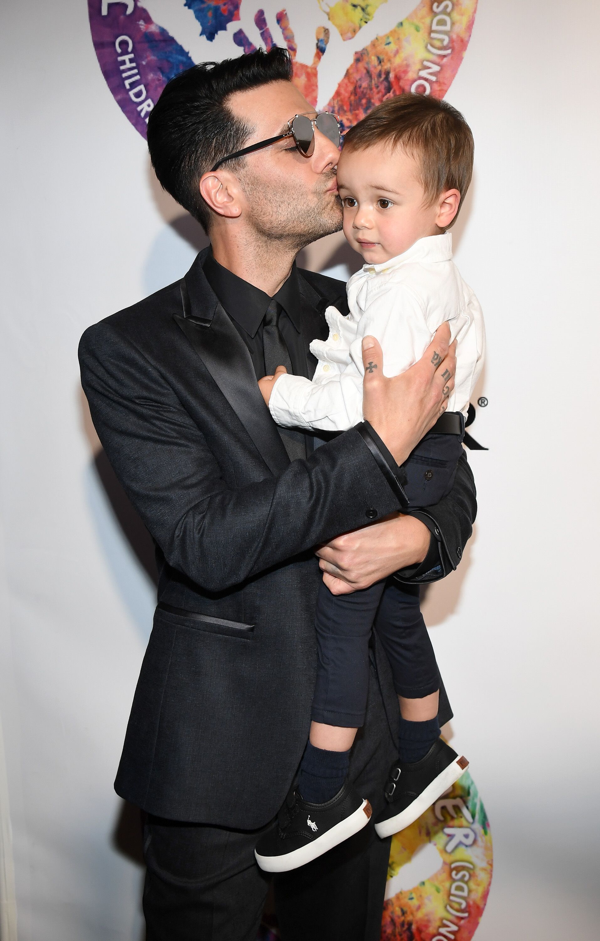 Criss Angel with his son Johnny Crisstopher at Criss Angel's HELP (Heal Every Life Possible) charity event in Las Vegas in 2016 | Source: Getty Images