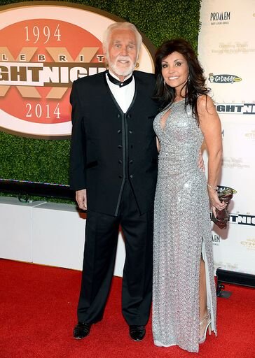 Kenny Rogers and Wanda Miller at Muhammad Ali's Celebrity Fight Night XX held at the JW Marriott Desert Ridge Resort & Spa on April 12, 2014 in Phoenix, Arizona. . | Source: Getty Images