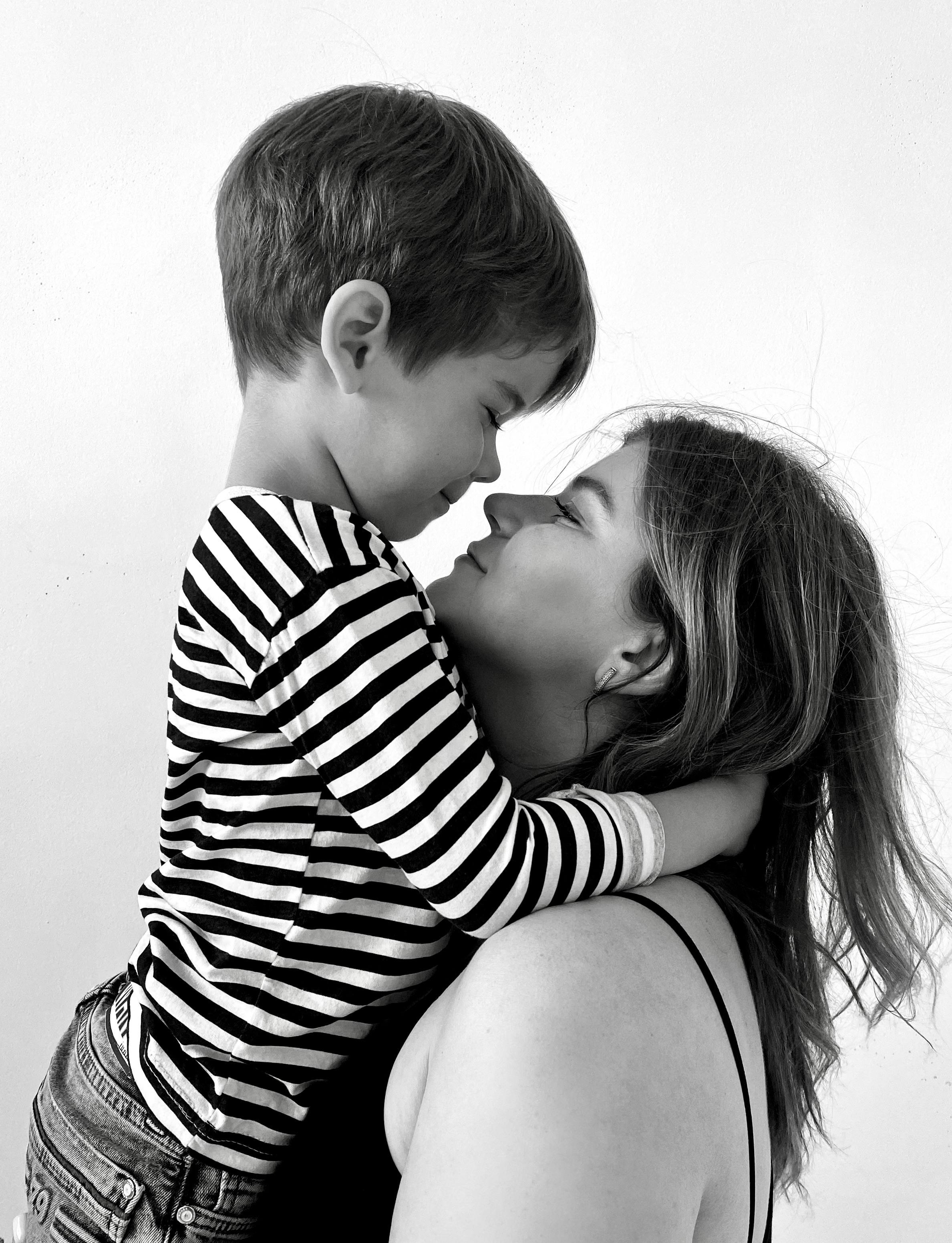 Grayscale image of a mother and son | Source: Pexels