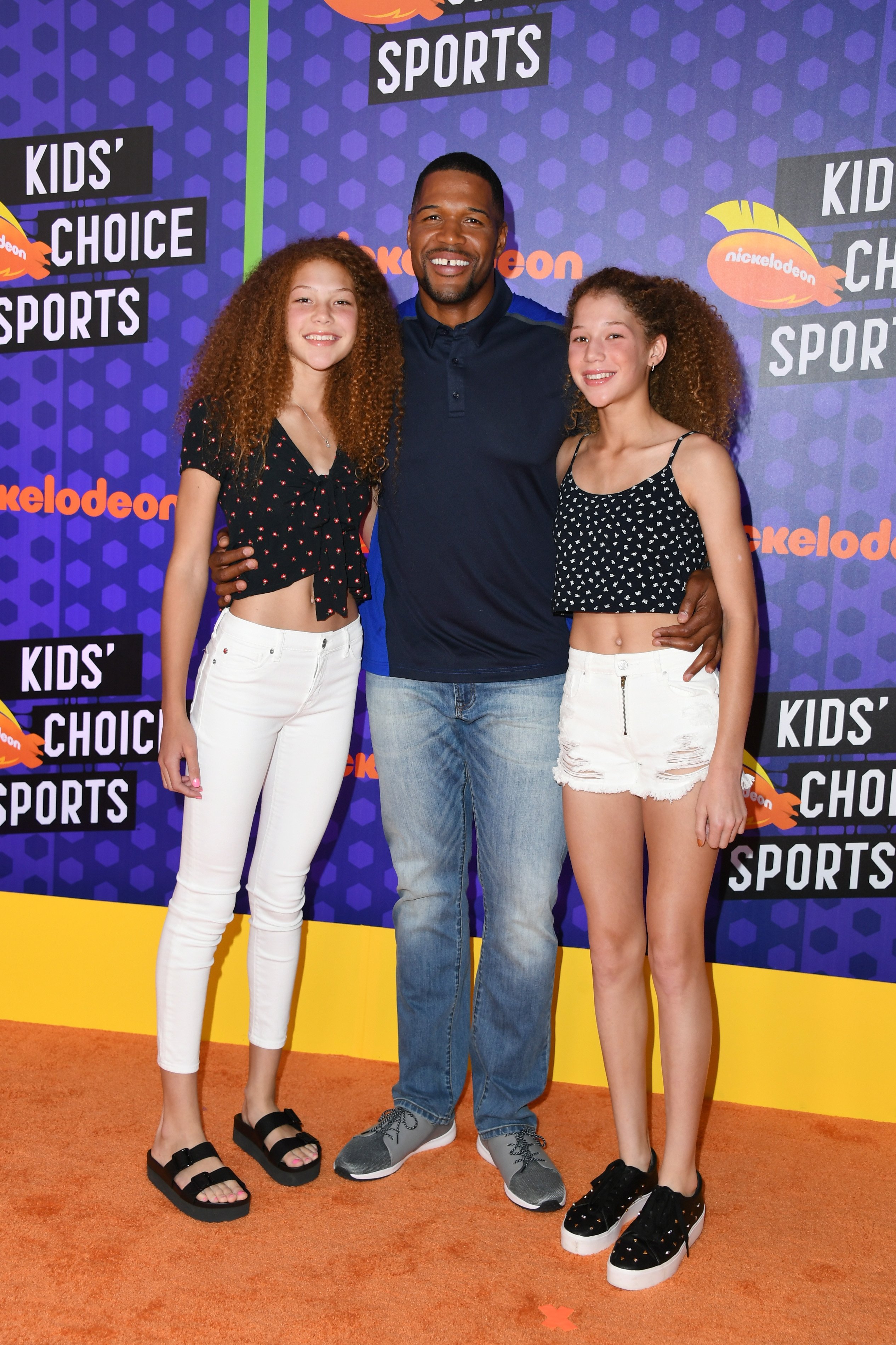 Michael Strahan and his twin daughters, Sophia and Isabella. | Source:  Getty Images