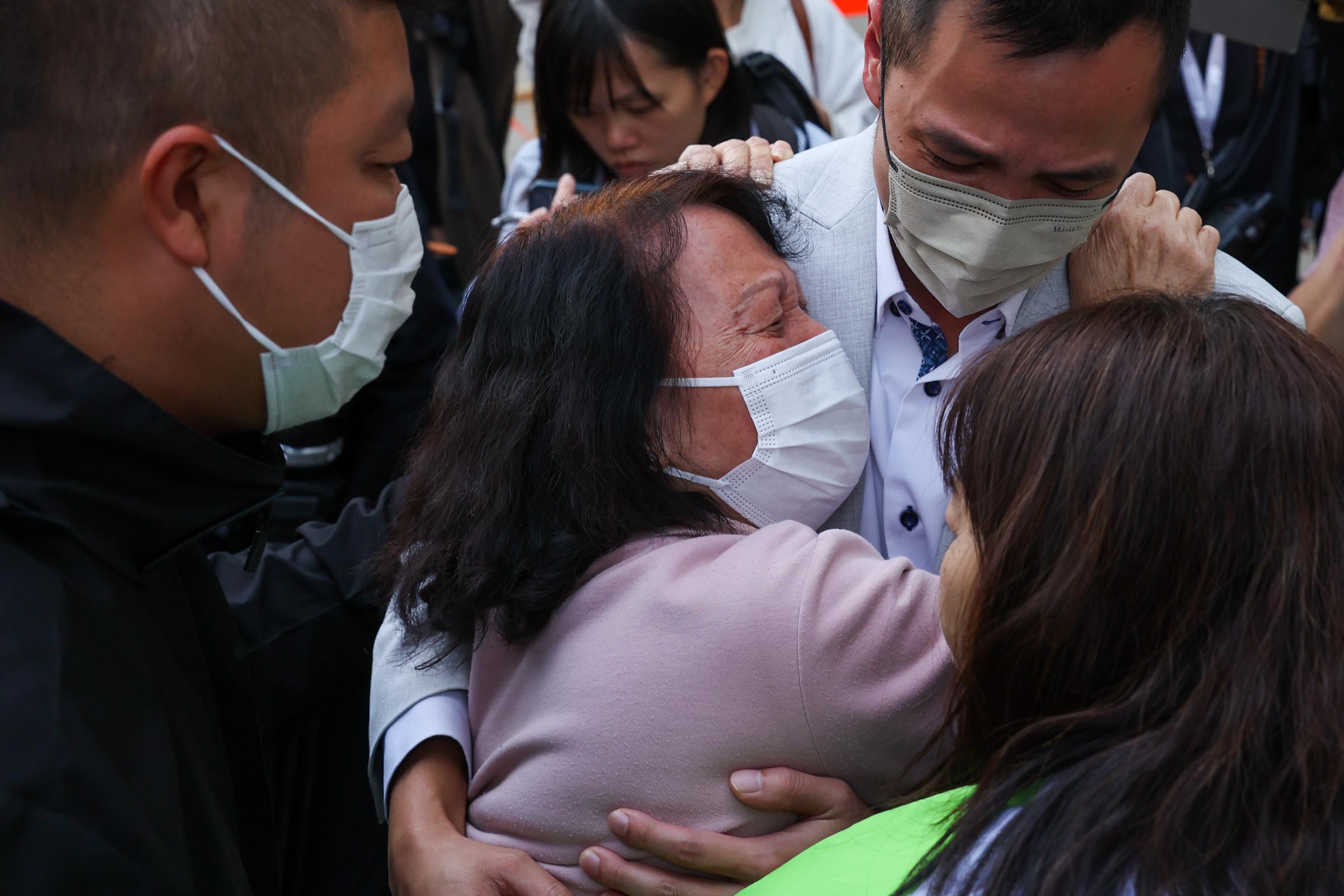 A woman breaks down after learning the death of her relative as rescue efforts continue at the Wang Fuk Court residential buildings, in Tai Po, Hong Kong, on November 27, 2025. | Source: Getty Images