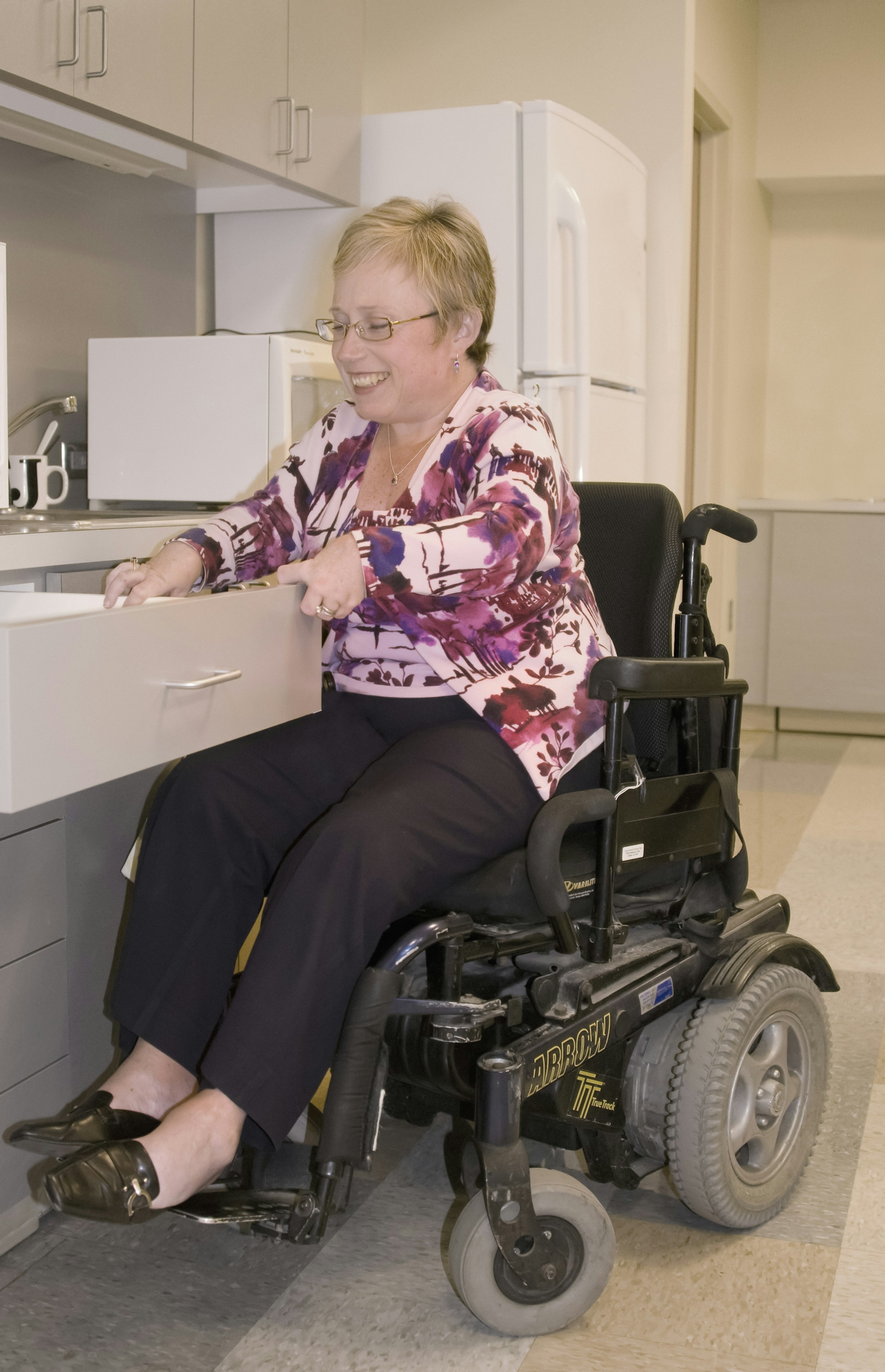 A smiling woman in a wheelchair | Source: Unsplash