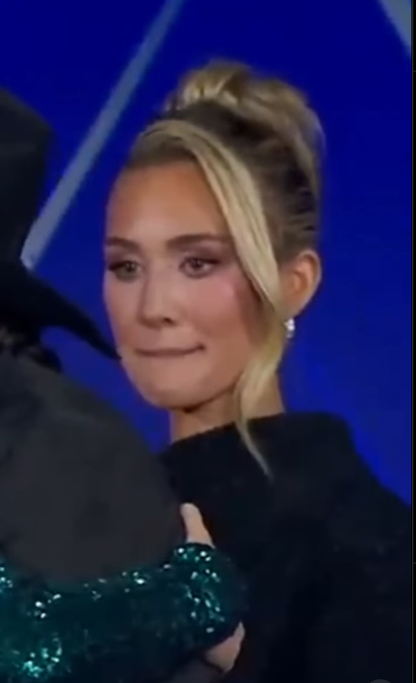 Brittany Aldean looks on as Erika Kirk and her husband Jason Aldean embrace during the 2025 Fox Nation Patriot Awards | Source: Instagram/the.independent