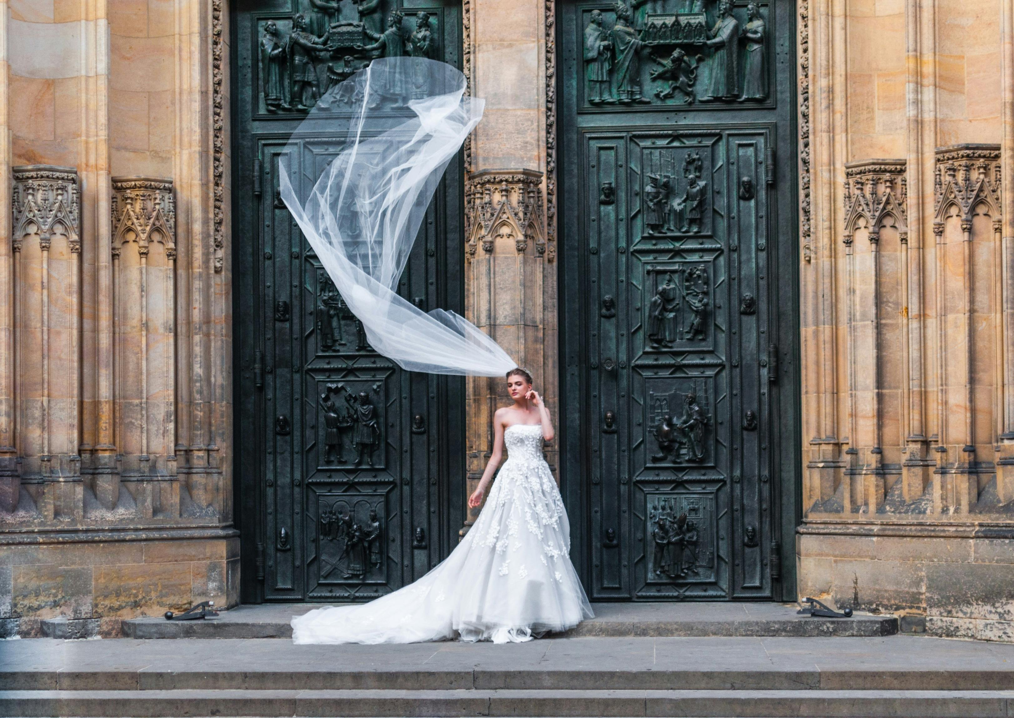 A bride standing outside closed doors | Source: Pexels