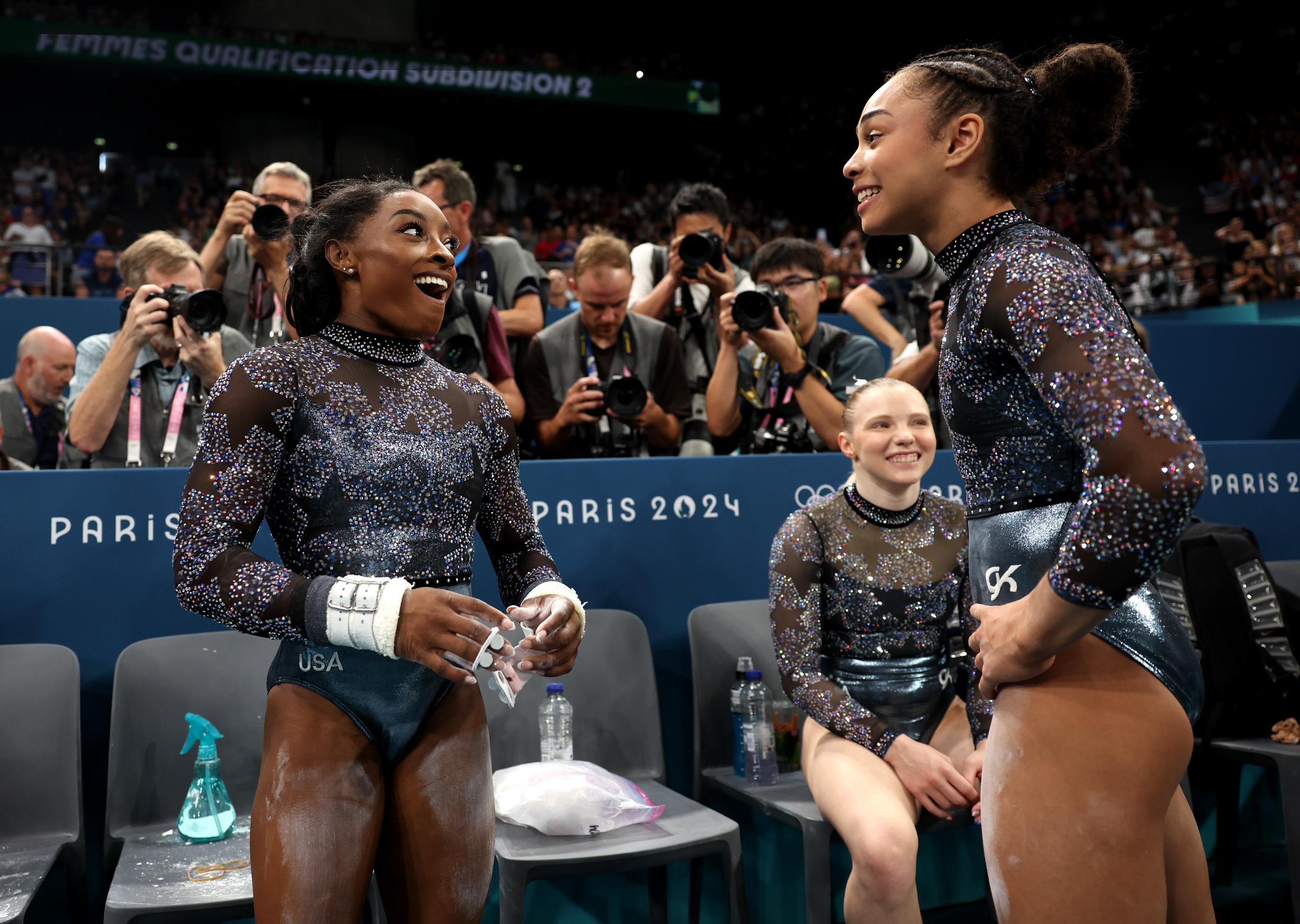 Simone Biles, Jade Carey, and Hezly Rivera react during the Women's Artistic Gymnastics Qualification at the 2024 Paris Olympics on July 28, 2024 | Source: Getty Images