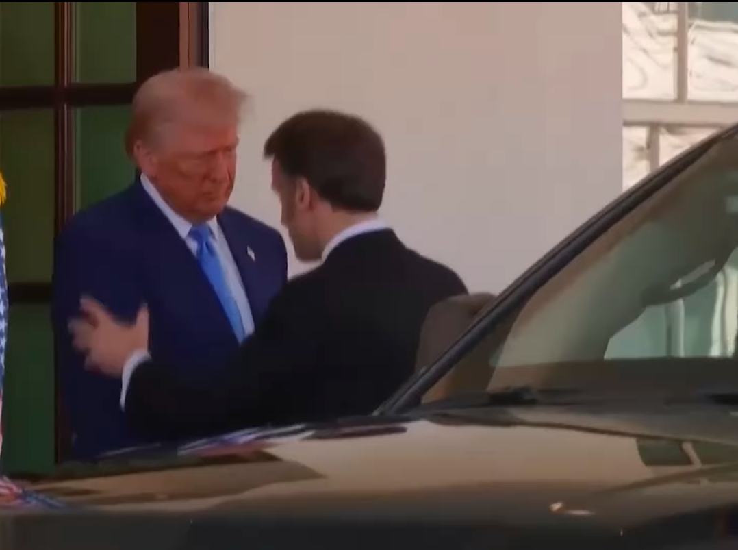 Donald Trump and Emmanuel Macron shaking hands and exchanging words. | Source: Facebook/USA Today